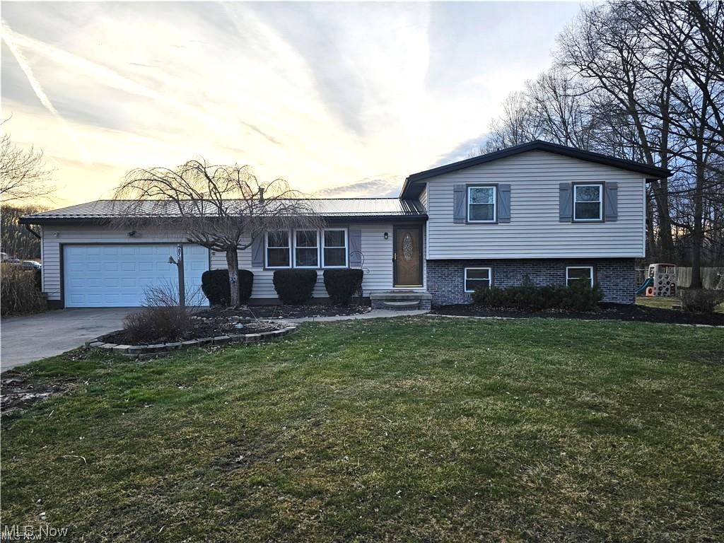 Welcome to this charming split-level home nestled on a sprawling 4+ acre lot, offering the perfect blend of comfort, space, and tranquility. Boasting 4 bedrooms and 2 full baths, this residence provides ample room for both relaxation and entertainment.  Step outside to your outdoor playground, including a hunting blind for the nature lovers and a playground for the kids.

The main level features a spacious living area, ideal for hosting gatherings or simply unwinding after a long day. Adjacent is the dining room with a walk out deck and equipped kitchen with new appliances in 2019.  Other improvements include a new metal roof (2023), A/C Compressor (2023), Wash Machine (2022) & Sump Pump (2023).

Ascend a few steps to the upper level, where you'll find the three bedrooms and a full bathroom, each offering comfortable accommodations and plenty of natural light. 

Downstairs, the lower level presents additional living space, perfect for use as a family room, home office, or gym and a full bathroom – the possibilities are endless. Sliding glass doors lead to the expansive backyard, where endless outdoor adventures await on the vast 4+ acre lot.

Outside, the property showcases plenty of space for gardening, recreation, or even the addition of a pool, allowing you to fully embrace the beauty of nature right at your doorstep.

Conveniently located within close proximity to I-76 for quick commutes, Kent State & Akron Universities. Located in Rootstown School District with the option to open enroll in Southeast Local Schools including Southeast bus transportation.  Don't miss your opportunity to make this stunning split-level retreat your own – schedule your private tour today!