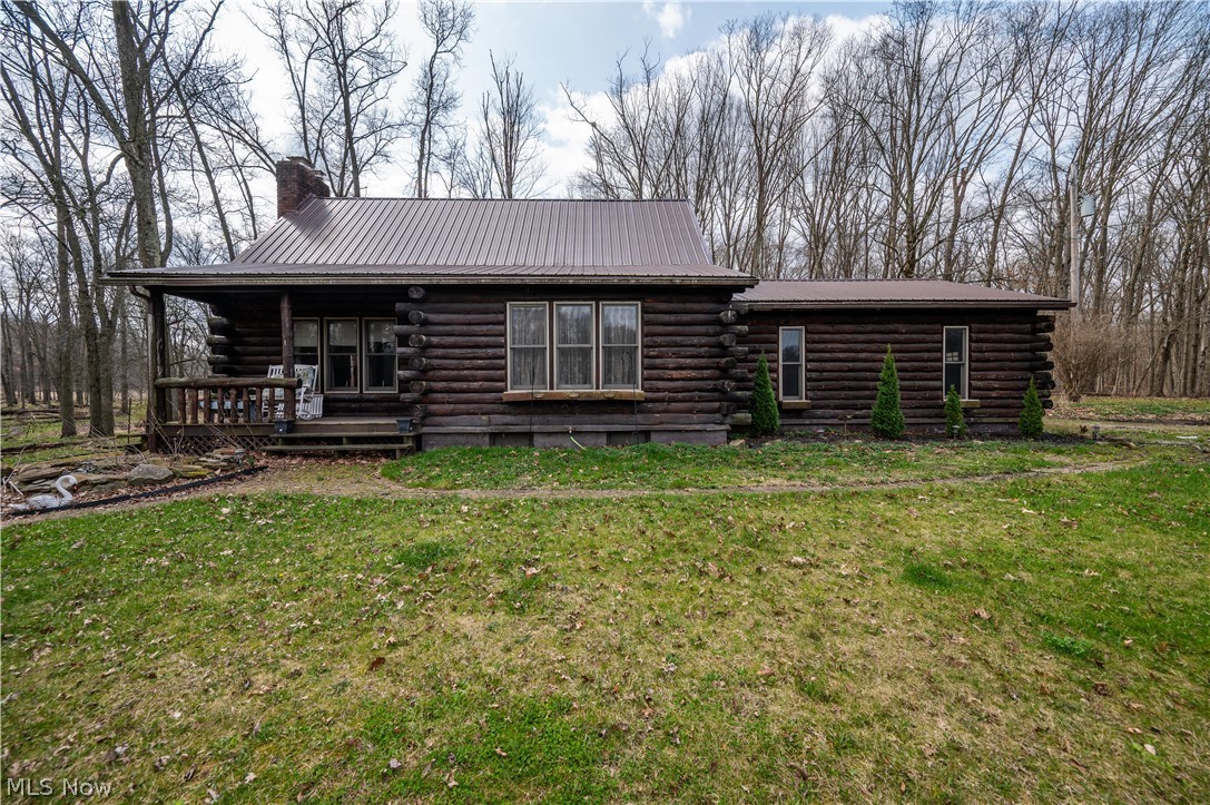 Nestled on 8.3 scenic acres in desirable Lake Milton, this charming two-bedroom, one-and-a-half-bath log home offers the perfect blend of rustic character and modern comfort—just minutes from the shores of Lake Milton.

Step inside to find a warm and inviting interior featuring a custom cherry kitchen with beautifully crafted cabinetry and rich hardwood floors that flow throughout the home. The main level offers a convenient first-floor bedroom and full bath, while the second-floor loft provides a spacious and versatile retreat—ideal as a second bedroom, office, or additional living space—complete with its own half bath. A full basement adds valuable storage or potential for additional living space.

Outside, the property is a dream for hobbyists, equestrians, or those seeking room to roam. It includes two barns—one designed for equipment storage and another fully equipped with horse stables—along with fenced-in pastures ready for livestock. The expansive acreage provides privacy, open views, and endless opportunities for outdoor enjoyment.

Whether you’re looking for a peaceful country escape, a hobby farm, or a full-time residence close to the water, this unique property delivers it all.
