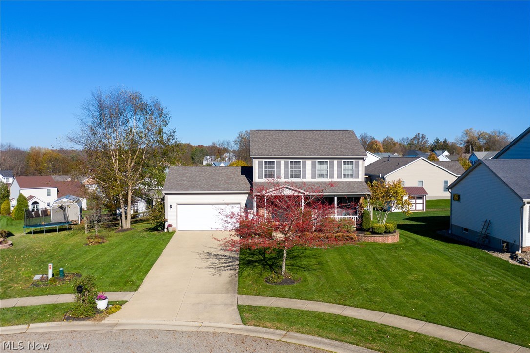 Beautifully finished 3 bedroom, 2 1/2 bath colonial located on a cul-de-sac in Field Local School District. The front porch spans the entire width of the house, and is it’s own oasis! Updated lighting fixtures, and engineered hardwood floors throughout. Large living room, kitchen includes a peninsula for extra seating and is open to dining area. Sliders lead to private deck, fenced in back yard and shed. Lawn and landscaping have been meticulously cared for. Upstairs you will find the master bedroom, with master bath and walk in closet. Two additional bedrooms share a hall bath. The unfinished basement is ready for your finishing touches.  The basement was built with higher than standard ceilings, and is also plumbed for an extra bath. Do not miss this meticulously cared for home!