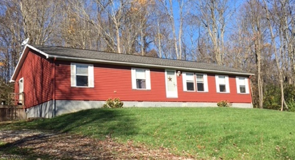 Well cared for ranch home on  6+ secluded acres. This modular home boasts 3 bedrooms and 2 full baths on a crawl space. Large 32x36 garage/outbuilding with concrete floor and electric.