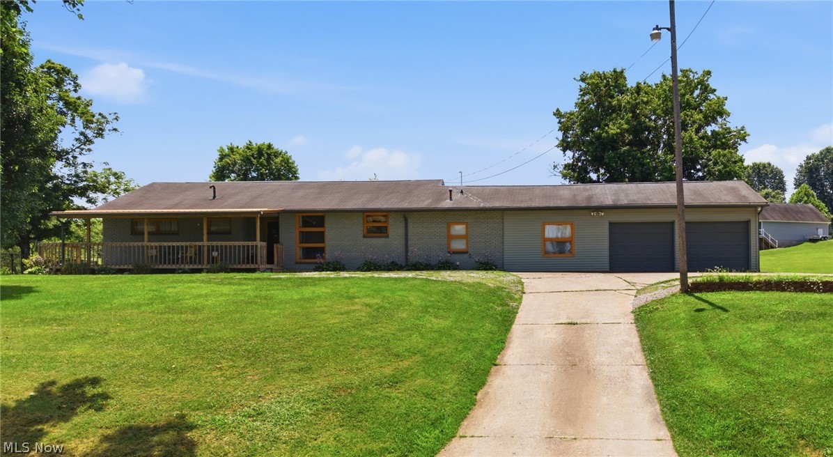 Escape to peaceful country living with this beautifully maintained 3-bedroom, 2-bath Ranch home nestled on a 3 scenic acre private road. Offering the perfect blend of privacy, functionality, and outdoor enjoyment, this property is a rare find. Wake up each morning to tranquil pond views and enjoy your coffee from the charming new front porch, complete with a stunning copper roof that's only two years old. Inside, you'll find beautiful hardwood floors, a cozy wood-burning fireplace, and a bright four-season room featuring a mini-split system for year-round comfort. The inviting kitchen offers warm oak cabinetry, a stylish tile backsplash, ample workspace, and all appliances convey, making it move-in ready from day one. Designed for those who need extra space, the home includes a 20' x 28' attached garage plus an impressive 14' x 40' detached garage/workshop with its own electric meter and water, making it ideal for hobbies, a workshop, or storing ATVs, boats, and recreational equipment. There's also dedicated RV parking, two additional storage buildings, and a fenced area perfect for pets or children to play safely. Nature lovers will appreciate the mature landscape featuring apple, pear, walnut, hickory, and willow trees, creating a picturesque setting throughout the seasons. The home's exterior was professionally painted just two years ago, adding to its curb appeal and peace of mind. Whether you're looking for room to spread out, space for all your outdoor adventures, or simply a peaceful place to call home, this exceptional country property offers it all—just minutes from the conveniences of Parkersburg.