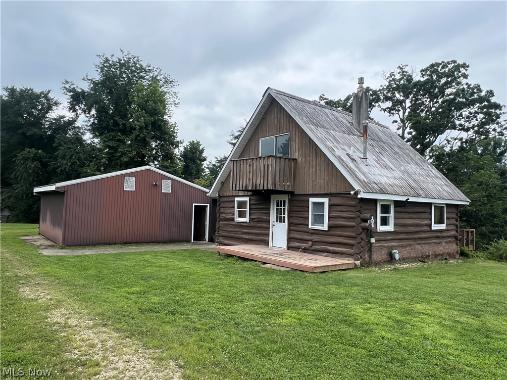 Come take a look at this 35 acres with a 3 BR, 2 bath cabin and 48x48 pole building! Just a few minutes off of I-77 on paved roads. Makes a great getaway, hunting camp, or live here full time. Wooded and open ground with a deer feeder and hunting blind included. Has frontage on I-70 for billboard income possibilities.