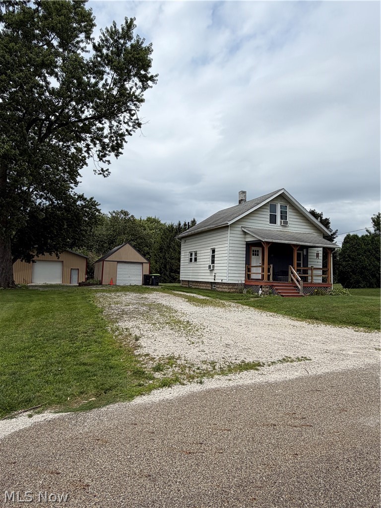 Welcome to this beautiful bungalow situated on nearly half an acre with a spacious yard! The main level features a full bathroom conveniently located off the kitchen, while the upper level offers vaulted ceilings, two bedrooms, a loft area, and a half bathroom. Newer windows provide plenty of natural light throughout the home. Outside, you’ll find a one-car detached garage with an attached rear shed, plus a large finished outbuilding with a metal roof—perfect for additional parking, storage, a hobby space, or entertaining. All garages and outbuildings are equipped with electricity. Additional highlights include a large basement with a workshop, a water softener, a welcoming front porch, and all appliances will be staying with the home. Come see everything this charming property has to offer! Call today with questions or to schedule your private showing.