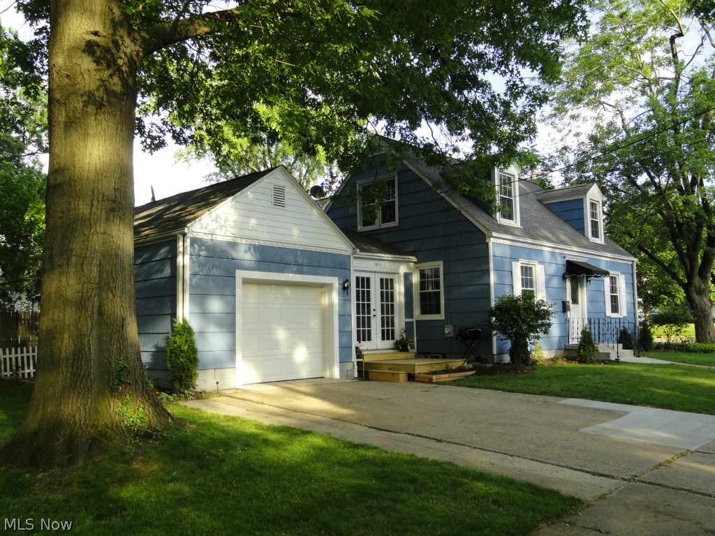 Charming Cape in desirable Falls neighborhood beautifully restored with quality finishes and tasteful décor throughout.  The extensive remodeling includes a gorgeous new kitchen with cherry cabinets, new counters, stainless appliances and porcelain tile floor.  Dining room and spacious living room are neutral, light and bright.  Beautifully refinished hardwood floors throughout.  2 full baths (one on second floor off master bedroom) both completely remodeled with stylish fixtures and porcelain tile.  Professionally finished rec room with new carpet, utility cabinets, and built in speakers for a media center.  New deck, entry slab, doors, light fixtures, garage door, water tank, electric, washer, and exterior paint.  Updated roof, gutters and windows.  Must see!