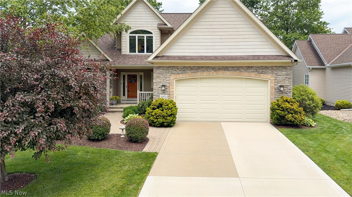 Beautifully updated and maintained home a stones throw away from lake Erie, offers a walking path to the lake with a beach! 
This enchanting home offers vaulted ceilings, a impressive brick gas fireplace, first floor master bedroom suite, real hardwood floors, and a recently added finished basement.  
Step inside the foyer then check out the dedicated dining room with wood trey ceilings.  The kitchen is very spacious and offers Corian countertops, island workspace, stainless steel appliances and plenty of room for dining.  The living room offers large picture windows that frame the floor to ceiling stone fireplace all while overlooking the well landscaped back yard.  This home has a wonderful master suite oasis with patio doors to the back yard patio, walk in closet and master bathroom suite compete with double sinks, large soaking tub and walk in shower.  The first floor also features a half bathroom and large laundry room.  
On the upper level there are two additional spacious bedrooms and a second full bathroom.  
The lower level was recently finished and offers plenty of space for recreation.  There is also lots of unfinished space for great storage!
Step outside onto beautiful landscaped outside living space complete with brick patios, wood deck, irrigation system, mature trees and well landscaped walkways.  The neighborhood not only has a path to the lake but also a great park with large pavilion.  
This home is a one of kind opportunity.  Set up a private appointment before it's gone.