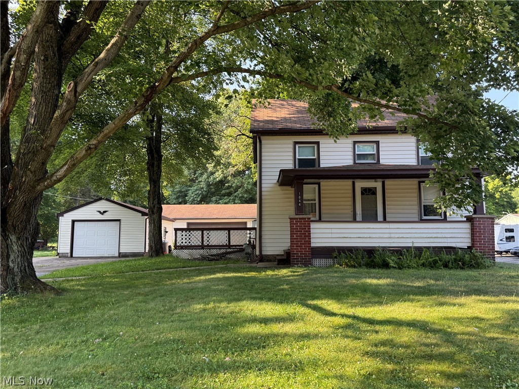 Welcome home to 1644 Mahoning Trumbull County Line Rd.  This charming two bedroom, one bathroom two story has a lot of potential.  Wake up and enjoy your coffee on the covered front porch or the deck on the side of the house.  Newer windows through out the house.  Newer Vinyl Siding.  Beautiful corner lot with  mature trees that make it look like home.  Glass block windows in basement. Black top and Concrete drive with spacious parking, two garages and a shed.  A two car garage and a three car garage with electric doors.  With some TLC you could make place this your own. Mineral Ridge Schools.  Austintown township.  Conveniently located near restaurants, shopping and main roadways.   Schedule a showing today!!  Won't last long.