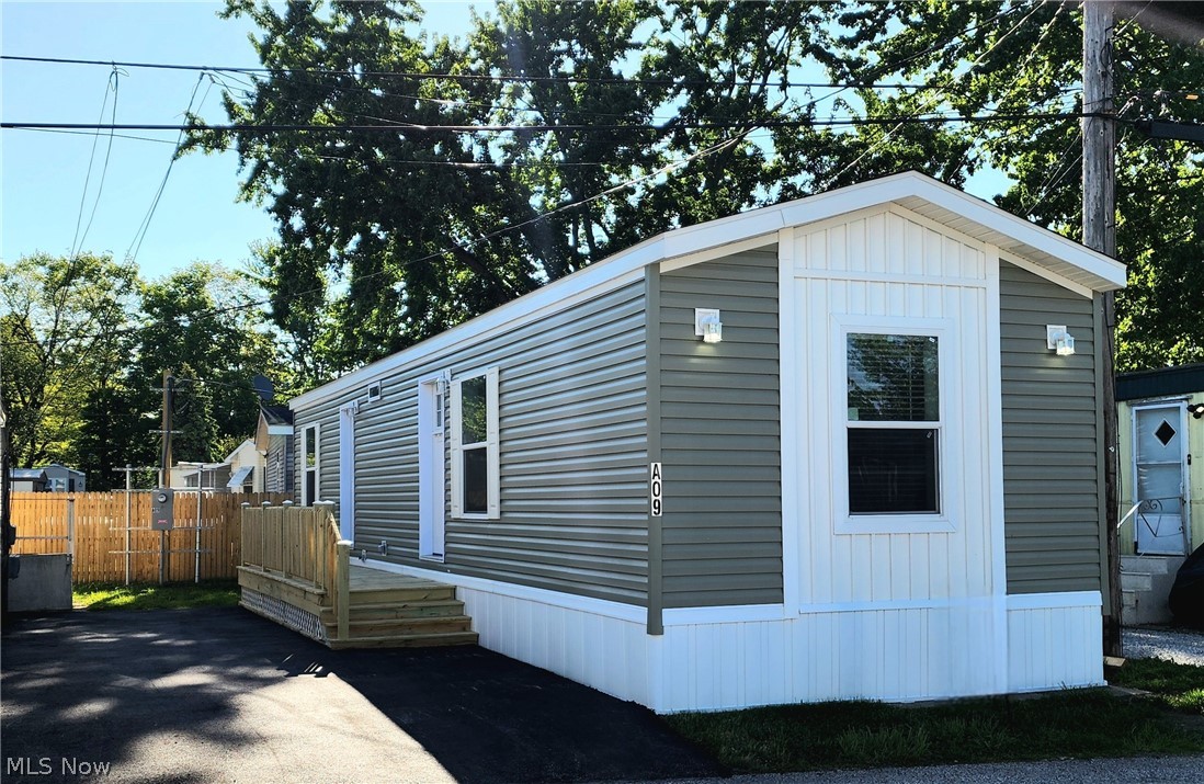 Just Delivered and Move-In Ready! Welcome home to this beautifully designed 2-bedroom, 1-bath residence offering effortless, low-maintenance living in the heart of Mentor—conveniently located near shopping, dining, and everyday essentials.
Step inside to a thoughtfully designed floor plan featuring a modern kitchen fully equipped with appliances, generous cabinet space, and an open flow into the main living area. The home also includes a dedicated laundry space, with the option to bring your own washer and dryer.
Enjoy stylish vinyl flooring throughout the main living areas, while both bedrooms feature soft carpeting for added comfort. Step outside to relax on your brand-new deck—perfect for enjoying the warmer months ahead. A new driveway was installed also adding even more convenience.
This home is located within a community that requires park approval prior to purchase. Monthly lot lease is $575.
Don’t miss this opportunity to own a brand-new home in a prime location—contact us today to learn more about community guidelines and the purchase process!