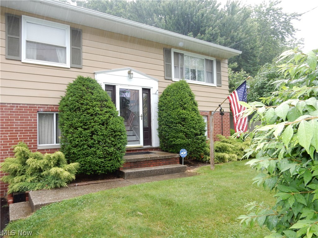 Beautifully maintained Bi-Level. You won't find this much home for the price. There are many updates, including a wonderful front door with sidelights, fantastic updated kitchen with stainless steel appliances that opens nicely to the dining room, recently stained original hardwood floors throughout the main living level and gas hot water heater (2010). The dining room has french doors leading out to the updated large deck that overlooks the spacious back yard. The large main level bath is updated and offers storage space for your linens. There is also a laundry chute that allows those dirty cloths to fall conveniently to the basement laundry area. 3 spacious bedrooms offer ample closet space that are extra deep. Down stairs, you will find a second living space that could be used as a media room or just for entertaining. This area offers convenient access to the laundry, storage and mechanicals, another full bath and access to the fully fenced back yard. The garage is extra deep (24x13