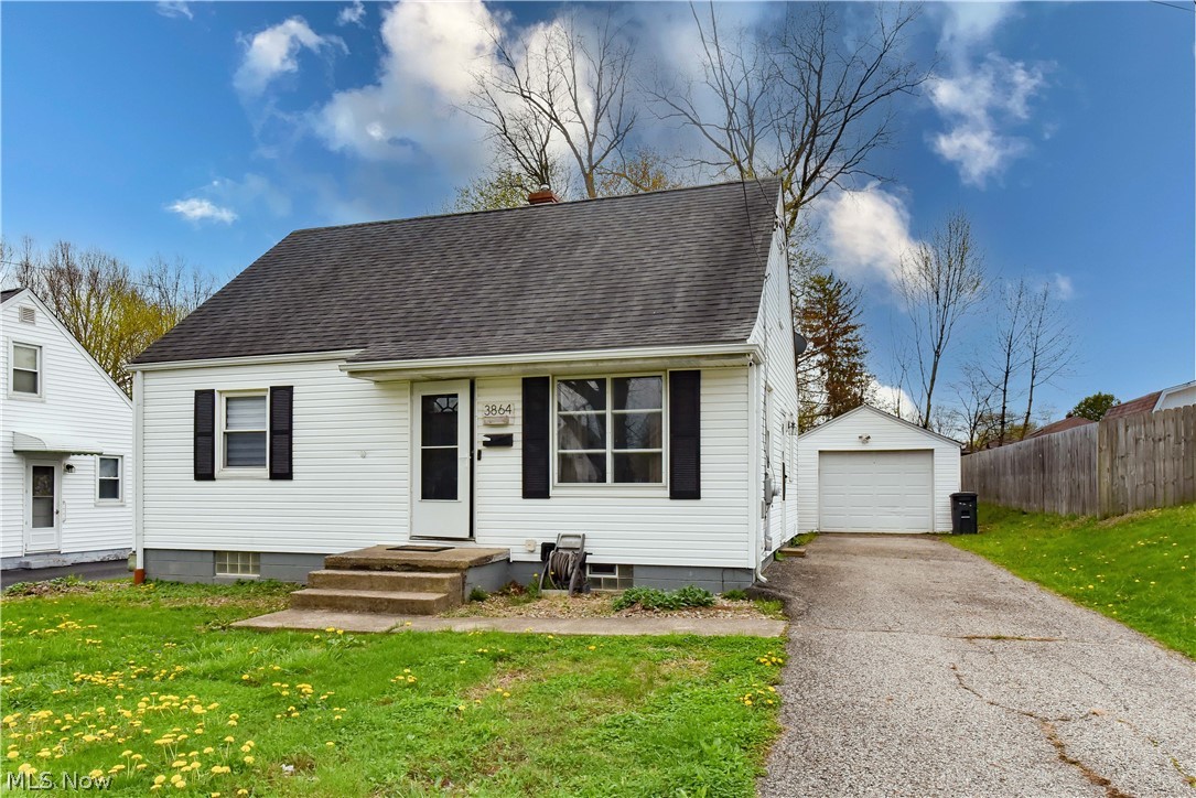 Don't miss this charming cape cod in the heart of Mogadore!  Enjoy cooking delicious meals in your eat-in kitchen featuring a gorgeous subway tile backsplash (2023) that complements the black and white cabinetry and LVT flooring.  A stainless steel refrigerator, dishwasher, microwave and electric range all convey with the home.  Welcome guests to your home in the well-lit and freshly carpeted living room (May 2026).  Sleep well in the first floor bedrooms with new carpet and ceiling fans or in the large second floor bedroom that features a large closet and new carpet (2026).  The full bath on the first floor has Luxury Vinyl Tile flooring and bathtub/shower combo with white vanity.  The full basement boasts high ceilings, glass block windows, plenty of storage space, high efficiency furnace, large utility sink and laundry area.  Entertain friends and family around the fire pit in your fenced in back yard. A one car detached garage with electric door opener complete the property. Other updates include: interior paint 2026, hot water tank 2017, roof, AC, and electric panel in 2010.  Located within walking distance to downtown Mogadore and minutes from I76.  Call your favorite Realtor and schedule a private showing today!