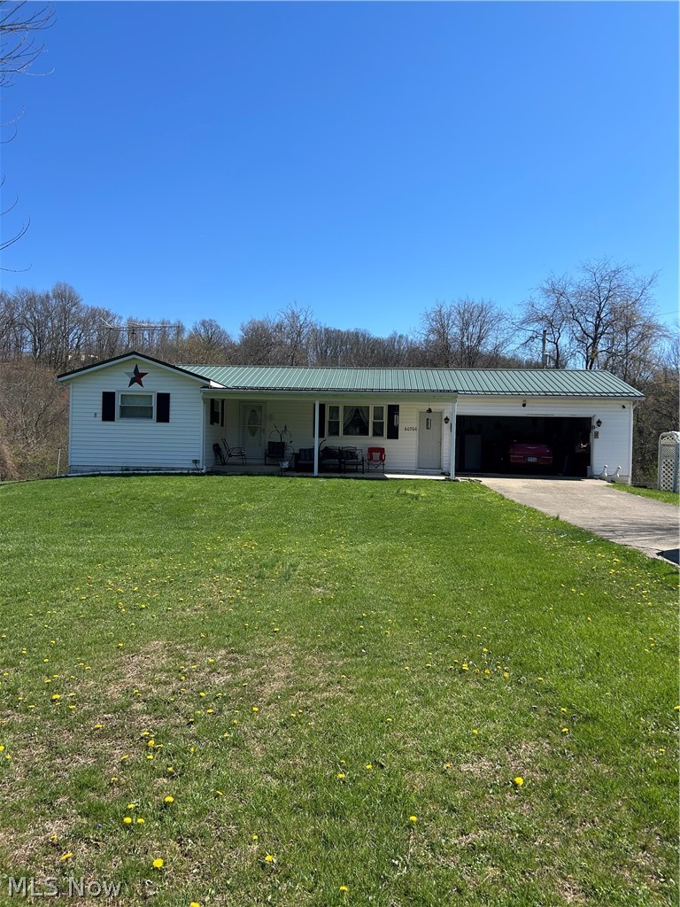 Well-maintained ranch home situated on approximately 1.44 acres in a quiet country setting. This property offers 3 bedrooms and 2 full baths, with a functional layout and comfortable living spaces throughout. The home features a spacious living area, an eat-in kitchen with ample cabinetry, and a partially finished basement providing additional space for storage or recreation. Enjoy the convenience of an attached 2-car garage along with a detached garage for extra parking, workshop space, or hobbies. Relax on the covered front porch or take in the surrounding natural views from the property. Additional features include central air and a private septic system. A great opportunity to own a home with both indoor and outdoor space to enjoy.