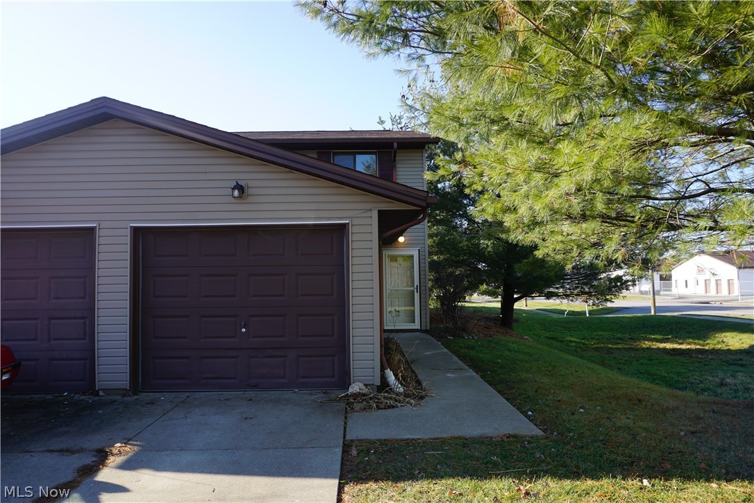 Lots of updates in this move-in ready two bedroom, one and a half bath townhouse!  Freshly painted, new upstairs carpeting, ceiling fans, front storm door and brand new hot water tank!  Kitchen features newly installed New Living Stone kitchen counters and all kitchen appliances stay!  For your convenience, the unit also features your own washer/dryer hook ups.  Attached is a 1.5 car garage that features additional ceiling storage space.  Relax on the back patio with privacy panels!  Come checked this unit out for yourself. Schedule your showing today!
