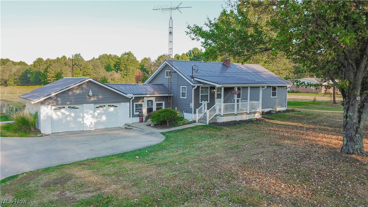 Welcome to this charming 2-bedroom, 2-bathroom home set on 15.86 peaceful acres—ideal for privacy, play, and hunting. A welcoming front porch leads into a comfortable living room that flows into the kitchen; just off the kitchen is a full bath, while the opposite side of the home hosts two bedrooms and another full bath. Upstairs, a versatile bonus room offers flex space for an office, hobby room, or guest loft. Outdoor living shines with a fenced in backyard, concrete patio (2022) anchored by a canopy and a backyard fire pit—perfect for morning sunrises and cozy evenings under the stars. Thoughtful upgrades include reverse osmosis water at the kitchen sink, a 2020 water softener, fresh interior paint throughout (2025), a refreshed front bathroom with new flooring, vanity, and toilet, a newer kitchen floor, and a living room floor updated about six years ago. Major improvements add peace of mind: new siding and windows (May 2023), a roof approximately three years old, a water heater about four years old, and an electric panel updated roughly six years ago. A rare blend of acreage, comfort, and move-in readiness—come make it yours.