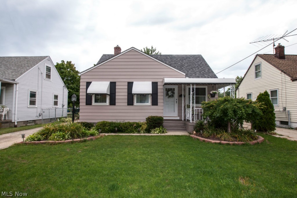 Come see this irresistible West Park bungalow just a short distance from the Metro Park! So many recent improvements inside and out! Welcoming open porch beckons you inside to crisp clean freshly painted interior with new fixtures throughout! Kitchen with newer easy care laminated floor includes complete appliance package! Cozy dining space open to living room creates an ideal space to entertain! Upstairs you will discover a roomy master suite featuring skylights, gleaming hardwood floors and custom built in dressers and bookcase! The full lower level with glass block windows includes a convenient half bath! The fully fenced yard includes an over sized 2.5 car garage, deck and patio perfect for summer gatherings! New a/c, windows, furnace, doors, roof, and more 2009! Home warranty included!