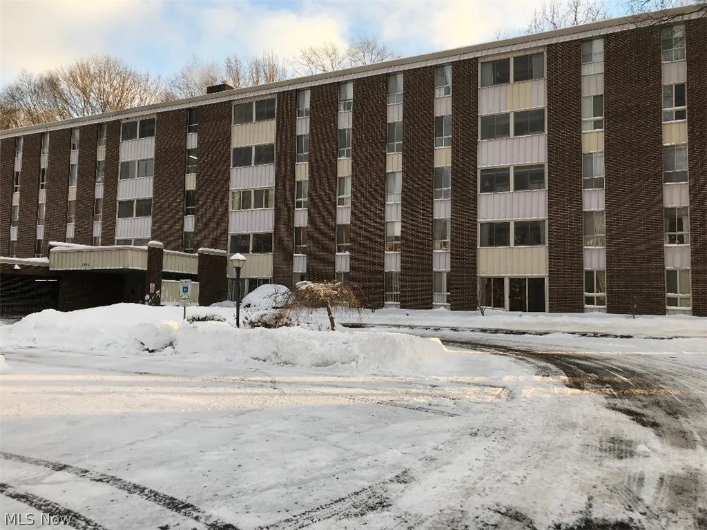 Sought after "first floor" walk out condo in Building C.  Freshly painted throughout and gleaming clean!  Enjoy the view as you enter the 3 season sun room that walks out to the patio! You'll love the cozy eating space in the fully applianced kitchen as well as a dining "L" perfect for entertaining just steps away. the dining area opens into the inviting living room.  Updates include bath, flooring and ceramic tile. The unit includes an assigned garage space and separate storage room.  The community features a party room, guest suites, an outdoor heated pool, clubhouse,  exercise room, craft room, bocce ball court and more.  The condo fee includes all the utilities and basic cable.