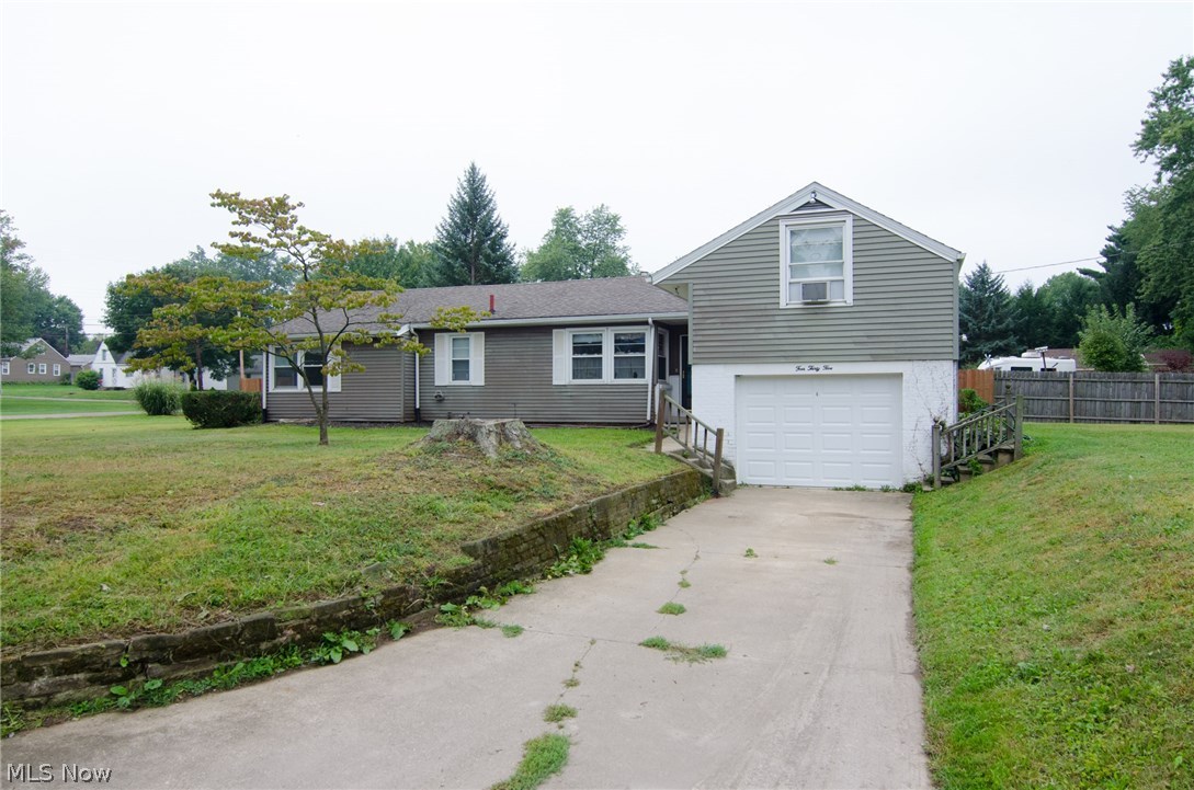 Double corner lot in Perry Township!!  Don't miss out on this incredible opportunity.  Located on nearly a half acre, lending itself to an additional garage/pole building, home addition, garden or just a huge space to call your own.  Enter into the large, open living and dining area. Here you have a working, wood burning fireplace, carpeted living room, vinyl floored entry and dining area and access to the patio.  The kitchen offers a gas range, built-in microwave, refrigerator, dishwasher, garbage disposal and eating area.  Around the corner you will find the family room/den and down the hallway, two bedrooms and a full bathroom.  Off of the living room on the second level is the large master bedroom with another working, wood burning fireplace.  There is a second 3 piece bathroom in the basement, as well as the washer/ dryer and a work bench.  Hardwood floors beneath the carpeting.  Freshly painted basement, newer furnace (3 years), updated electrical, vinyl replacement windows and a