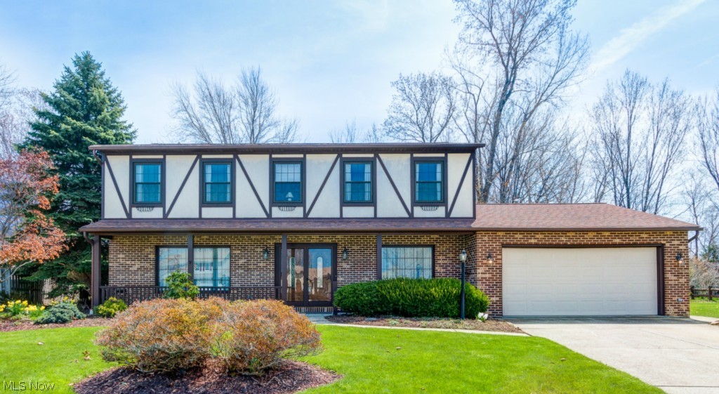 Located in Waterview Estates on a quiet cul-de-sac,  this beautiful, 4 bedroom, 2.5 bath Colonial is priced to SELL! This wonderfully well-kept home features an open concept, eat-in kitchen that opens to the living room showcasing a gorgeous fireplace. In addition, this home features neutral carpeting and decor throughout, a first floor laundry room and first floor half-bath, as well as a spacious sitting room and dining room. Upstairs, the large front bedrooms provide excellent, year-round views of Lake Erie, while the owner's suite and fourth bedroom overlook the private, partially fenced-in backyard. The owner's suite has significant closet space and recently updated private, full bathroom. With a roomy, enclosed sun room in the back and a sizeable front porch, this home is perfect for entertaining or watching Lake Erie sunrises. Other features include an attached 2 car garage with extra storage space, newer windows and light fixtures, and newer furnace, air conditioning, and hot wa
