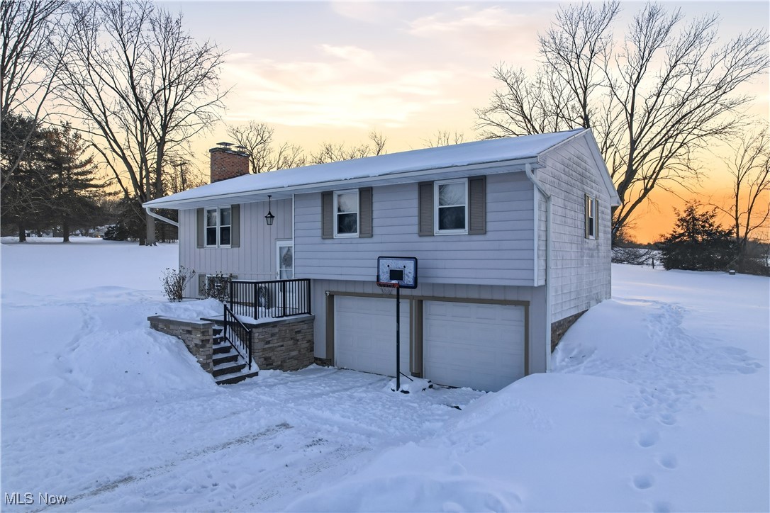 Welcome to this beautifully maintained 3-bedroom, 2-full-bath bi-level home, perfectly situated on a nearly one-acre corner lot just outside of Salem. From the moment you arrive, it’s clear this home has been lovingly cared for—and it truly shows throughout. The main level features an updated kitchen with quartz countertops, complemented by all-new solid oak interior doors and trim that add timeless warmth and character. The living and dining areas offer a cozy yet spacious feel, with the dining room opening through sliding glass doors to a brand-new deck—ideal for relaxing or entertaining while enjoying the peaceful surroundings. All bedrooms and bathrooms are conveniently located on the main level, including a primary suite with its own private full bath and walk-in shower. Downstairs, you’ll be pleasantly surprised by the generous additional living space, featuring a comfortable family or media room along with a separate hobby room or workspace. A full-size laundry area with ample storage and a 2-car garage complete the interior features. Outside, the home sits on two lots totaling just under an acre, offering endless possibilities for hosting, entertaining, gardening, or future building. Major updates provide peace of mind, including a new roof (2024), gutters and downspouts, deck, sump pump, appliances, hot water tank, baseboard heaters, new front porch concrete and stone wall, solid oak interior doors and trim, and a newly installed off-site septic system. This move-in-ready home is truly ready for its next owner to love and enjoy.