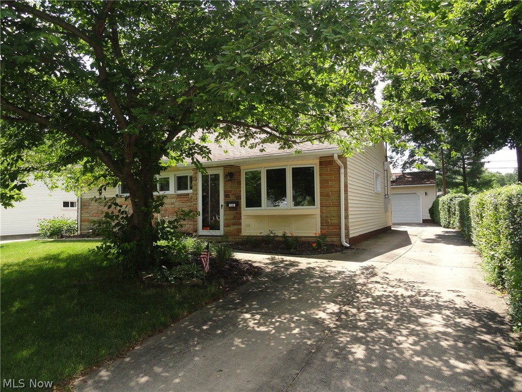 Sharp ranch in excellent condition located in a desirable Cuyahoga Falls neighborhood. Spacious living room with crown molding and bay window. Nicely updated kitchen with ceramic tile, oak cabinets, and stainless appliances. New windows throughout and updates bathroom too! Custom built, over sized 2 car garage with  gas heater, insulated walls, 220 electric, cable, and phone. Stone patio overlooks lovely yard plus custom shed with electric. Double wide concrete driveway too.