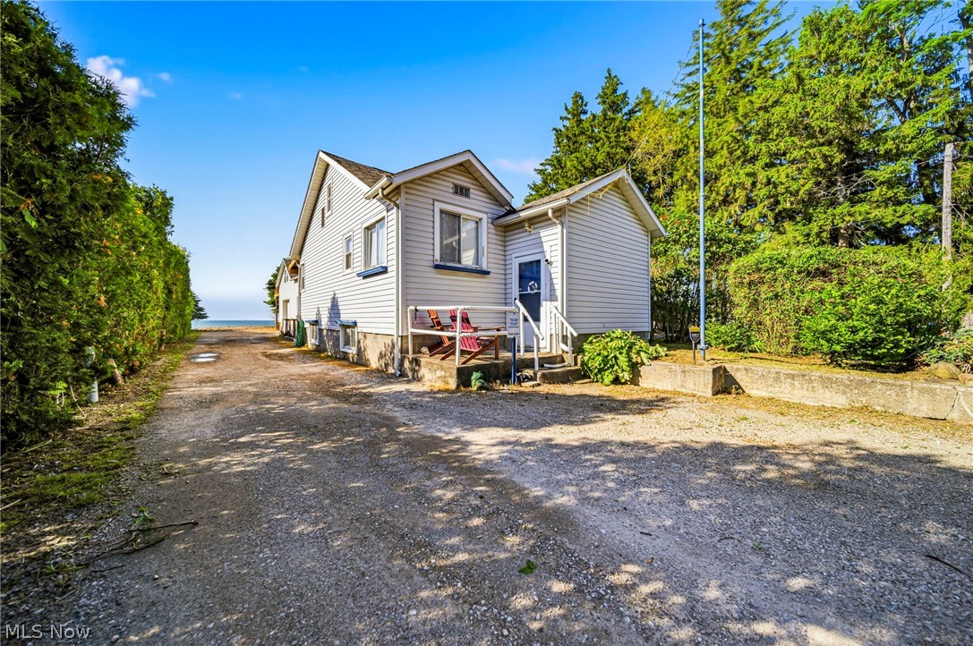 Welcome to this Lake Erie Front Home in Conneaut, OH featuring an Oversized Heated Garage with Workshop and an Apartment - All with Spectacular Lake Views! The Main Home at 1050 Lake Road is a 1 bedroom ranch with full walk-out basement. It was the original cottage on the property, later moved back from the lake to its current foundation in the year 2000. The Main House features a kitchen with island, a large bedroom with lake views, sitting room leading to a deck, full bath with garden tub on the main floor, and a fantastic walk-out family room in the lower level. The lower level also has the laundry room with connected 3/4 bathroom, and a panic room which could alternately be used for canning/storage. Walk out and up the ramp and you'll find the HUGE Garage - perfect for anyone who wants a comfortable workshop, boat storage, man cave, or all of the above! The Garage has 3 bays, water, floor drains, electrical, heated floors, 1/2 bathroom, 12 ft ceiling height, & 10 ft door height. Above the garage you'll find an adorable and useful apartment that's been mostly remodeled with fresh paint, newer kitchen cabinets, living area with sliding doors to the lake-facing balcony,  a 3/4 bathroom, and an oversized bedroom. This property has SO MUCH POTENTIAL, right on the lake, multiple dwellings - Perfect for someone looking for an in-law suite, multi-generational living opportunity, income property, or just looking to be on Lake Erie! Some cosmetic fixes could add value or make it your! Selling as-is. Furnace and AC new in 2025 for the Main House! All 3 water heaters newer. Flooring, kitchen, paint in apartment all done in May 2026. The apartment is gravity-fed heat from the heated garage below. See this one today!!