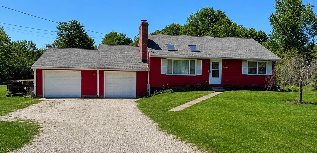 This beautiful split-Ranch sits on a generous 0.87-acre lot in an amazing neighborhood and Copley-Fairlawn Schools, boasting breathtaking views from multiple vantage points. The two-car attached garage comes with its own 110-amp box service (220V), making it ready for all your workshop needs. A huge standout feature is the back and front garage doors to facilitate easy through-access. A new 2024 large shed, plus an additional shed on the property, provide ample storage. Roof replaced in 2021, offering continued peace of mind, and the septic system is well cared for. 2 large tanks, both just emptied in 2025.  The aerator was installed in 2015 with a yearly service contract to ensure great care. The exterior grounds are highlighted by a breathtaking backyard lined with beautiful fruit trees, creating an ideal space for gardening, relaxation, and entertaining with lots of wildlife! Entering the home, you’re greeted by a cathedral ceiling and a cozy fireplace in the family room, establishing a warm, inviting ambiance. To the right, there is a first-floor primary suite with two closets, offering convenient single-floor living. Upstairs, you’ll find two additional bedrooms, one of which functions as a second primary with two closets. The lower level hosts a living room and a kitchen, forming a comfortable, open-concept living area. walking out of the living room to a covered concrete patio, perfect for outdoor dining and entertaining. This home will not last, priced to sell! Get in to view today!