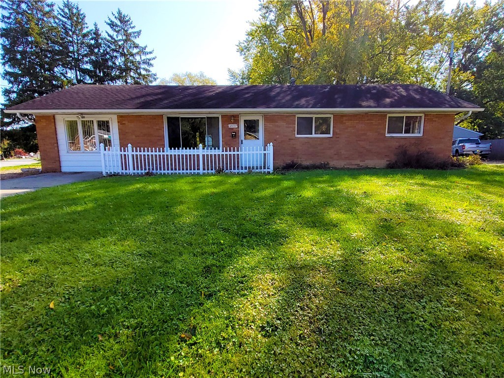 One floor living - no steps in this 3 bedroom, 2 bath brick ranch which sits on a good sized  corner lot in Stow.  Enjoy the sunrise on the back deck.   It was just painted and has all new carpet throughout.  New range and refrigerator. New Washer and Dryer October 2022.