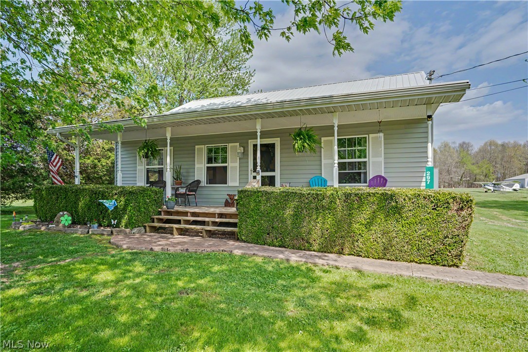 Price Reduction! You will not find an aviation home at this price point. Not all homes offer a runway to your lifestyle—welcome to 297 Hales Landing. Nestled within a private aviation community in Wirt County, WV, this thoughtfully updated 3–4 bedroom, 2 bath home blends everyday comfort with a rare opportunity to live where you can truly take off—literally.

Inside, the primary suite offers a private en suite bath, while two additional main-level bedrooms share a convenient Jack and Jill layout. Upstairs, the flexible bonus space can easily serve as a fourth bedroom, recreation room, home office, or cozy retreat with additional attic storage. The kitchen showcases oak cabinetry and hardwood floors, creating a warm and inviting space.

Recent updates include a newer metal roof, siding, HVAC system, Pella windows and sliding door, renovated bathrooms, new laminate flooring and carpet, newer appliances, and solid wood interior doors. A Cummins 17KW natural gas generator provides added peace of mind.

Situated on two lots totaling approximately 2 flat acres, the exterior is what makes this property truly exceptional. The 40x40 airplane hangar is ready for aviation use or serves as an impressive garage with space for up to 8 vehicles. Enjoy stamped concrete sidewalks, beautiful landscaping, and relaxing front and rear porches offering peaceful sunrise and sunset views. The rear porch renovation features gorgeous knotty pine ceilings, adding warmth and character to the outdoor living space.

Residents of Hales Landing enjoy access to a 3,100' x 75' private airstrip and clubhouse. Complete with a garden area, apple trees, and blueberry bushes, this property offers the perfect blend of country living, modern updates, and a one-of-a-kind aviation lifestyle.
