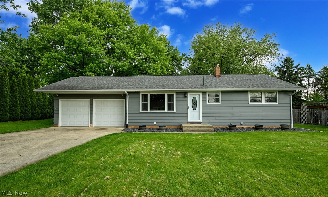 Wait, a Perry Township ranch for only $200k???  You betcha!  Incredible location just 3 minutes to Petros Lake Park (nature trails, lake, volley ball & picnic areas), about 5 minutes to 62, 10 to Navarre, Massillon or Canton!  This fantastic ranch sits on nearly a half acre, with a fully fenced in back yard and surrounded by beautiful mature trees.  A nice long concrete driveway and 2 car garage, means you will never have to worry about parking.  Inside are handsome original hardwood floors run through the living room and hall.  The kitchen is retro chic, with original double wall oven, gas cooktop and range hood, mixed with updated stainless dishwasher, fridge and microwave!  A skylight, window to the sunroom and wide openings to living and family rooms, give this room the feeling of extra space.  Add a small breakfast table in the kitchen and convert half of the living room as a formal dining space.  No worries because you still have a huge family room!  LVP, a large picture window, door to sunroom and a wood burning fireplace to top it off!  Back down the hall you will find the 3 freshly carpeted bedrooms, all with ceiling fans and chalk board painted closet doors.  A nicely updated bathroom provides a large linen closet, laundry chute, tub/shower combo and double vanity!  One of the best parts about a ranch is the opportunity to nearly double your living area!  A massive rec room, game or workout room is at the center, surrounded by a bonus (not quite completed bar room or office), laundry room and over-sized fully bathroom.  The bathroom has a brand new vanity, jetted tub/shower, plus a stand alone shower!  The back yard is gorgeous!  Full fenced in, a fire pit, swing spot, a huge shed with utility room and a patio!  On those rainy days there's an awesome enclosed porch where you can hang out and still enjoy the fresh air!  Don't miss the bonus shed, off the back of the garage too!  When opportunity knocks, you hurry to make an offer!