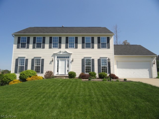 Beautiful Colonial in prestigious Springbrook Reserve! Quality built with tasteful décor and custom molding and trim  throughout. Step into the  2 story foyer entrance with gorgeous new cream colored  porcelain tile that continues into the kitchen where you will find cherry cabinets, granite counters, island bar and sun lit morning room with vaulted ceiling and wall of windows. French doors to formal living room or first floor office. Elegant formal dining room. Spacious family room with 9 ft ceilings , floor to ceiling windows and gas fireplace. First floor laundry too! 4 spacious bedrooms and 2.5 baths. New deck porch overlooks beautiful yard and lovely neighborhood.