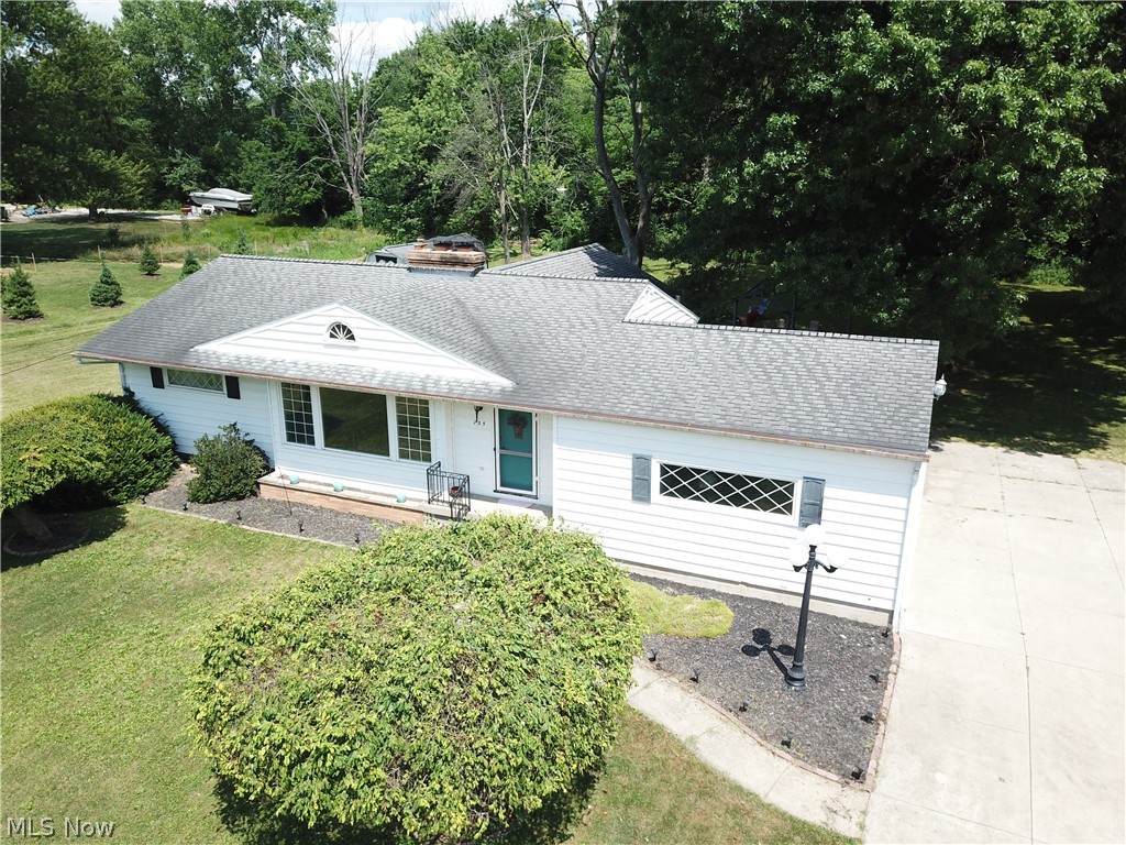 Welcome to 735 N. Hidden Valley Road in the very desirable Northampton Area of Cuyahoga Falls!  It is believed that this home was originally built as a 3 bedroom.  The wall of bedroom 3 was removed so that it opened to the family room addition.  There is also an addition of a sizable ensuite bath off of the owner's bedroom. The first floor now has 2 bedrooms and 2 full bathrooms.  Bedroom #3 can easily be restored with replacing a wall.  The access to the family room would then be solely through the kitchen.  I have bedroom #3 marketed as a dining room on this listing.  The living room measurements include the eating area and the foyer.  The kitchen was updated with white cabinetry and quartz countertops.  Other updates:  glass block windows, updated electrical panel, vinyl windows, Trane Furnace 2007.  The lower level features a full bathroom, a family room, an office and a large cedar closet.  The attached 2 car garage leads to the kitchen.  The driveway is a large concrete driveway with plenty of room for additional parking.  One year home warranty included.