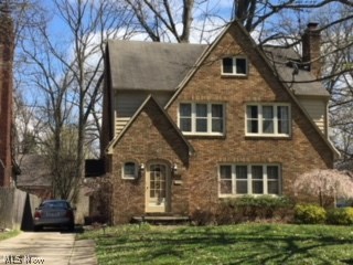 Make this your first home and enjoy all the charm of a traditional Tudor on tree lined Jennette Drive in the historical Newport Village of Boardman. This unique home has an openness that flows throughout the rooms.  There is over 1,800 sq ft with 3 large bedrooms, ample closets, wide hallways, even a sewing area or small office on the 2nd floor. Bookcases are on either side of the fireplace in the living room with hardwood floors and leaded windows. The formal dining room will accommodate the entire family for holidays.  Sunny breakfast area in the kitchen. includes the stove and refrigerator. Be sure to see the 3rd floor. It can be used for storage, a 4th bedroom, or quiet getaway.  Full basement, two car garage. Landscape lighting.