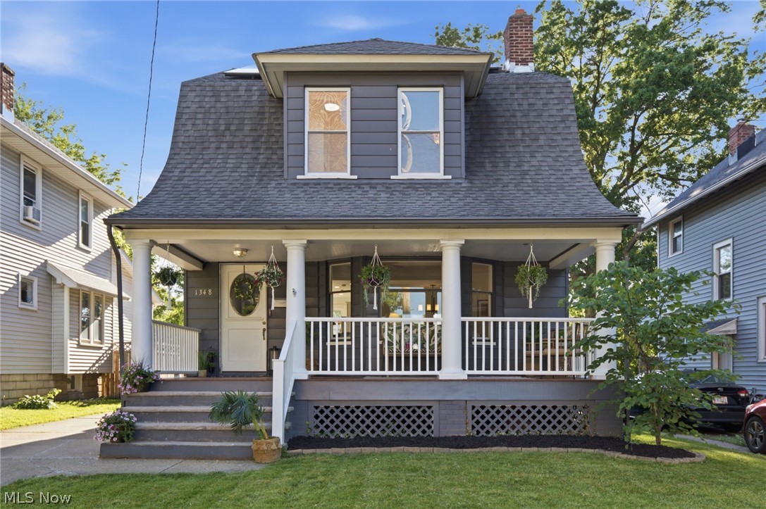 1348 St. Charles Avenue: The Opportunity of the Summer! Don't let this one slip away. This stunning 1909 colonial effortlessly blends historic charm with modern convenience, located mere steps from the heartbeat of Lakewood’s vibrant downtown core! From the moment you drift up the classic sandstone steps to the inviting front porch—featuring a brand-new tongue-and-groove floor and new wood railings—you'll know you've found something special. The original front door's expansive window offers a teasing glimpse of the bright, airy open floor plan waiting inside. Step through to discover an enormous living room with soaring ceilings, custom-made for hosting friends, family, and neighbors with plenty of room to spare. The seamless flow leads right into a spacious dining room, perfectly primed for large gatherings. Entertaining is a dream in the beautifully updated kitchen, where gleaming quartz countertops and stainless-steel appliances are highlighted by brand-new lighting and modern cabinet hardware. Upstairs, you'll find generously sized bedrooms alongside a lightly refreshed bathroom. Fresh paint and crisp trim throughout mean this home is completely move-in ready! Have grand renovation dreams? The sprawling unfinished attic and basement offer an incredible blank canvas to expand your living space and build out your vision. Save electricity with the 20 newer solar panels. Outside, your large, fully fenced backyard is just waiting to host the next neighborhood cookout. Plus, you will fall in love with the massive 2.5-car garage, complete with an 8-foot door to fit all your taller toys. With street festivals, local coffee houses, walkable shops, and exciting new city developments right around the corner, this is Lakewood living at its absolute finest. Properties with this perfect mix of character, updates, and location do not last. Contact your favorite fedora-wearing REALTOR today to schedule your private tour before this gem is gone!