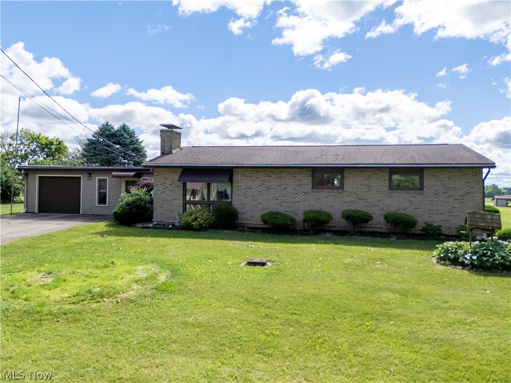 Welcome to 2442 Pleasant Ridge Road, Wooster. Situated on a scenic 0.46-acre country lot in the desirable Triway Local School District, this well-maintained 3-bedroom, 1.5-bath home offers the convenience of first floor living while being just minutes from all the shopping, dining, and amenities that Wooster has to offer.  Step inside to a spacious living room featuring soaring ceilings, abundant natural light, and a cozy fireplace that creates a warm and inviting atmosphere. The kitchen has been thoughtfully updated over the years, along with one of the bathrooms, providing modern touches while maintaining the home's charm. An additional finished living area located between the living room and attached two-car garage offers flexible space for a family room, office, recreation area, or hobby room.  Recent carpet updates and professional cleaning make this home move-in ready. Large windows throughout allow natural light to fill the living spaces, enhancing the home's bright and welcoming feel. Enjoy the peaceful country setting, ample outdoor space, and convenient location that make this property the perfect blend of rural living and everyday accessibility.  Don't miss your opportunity to own this charming home in a highly sought-after location!