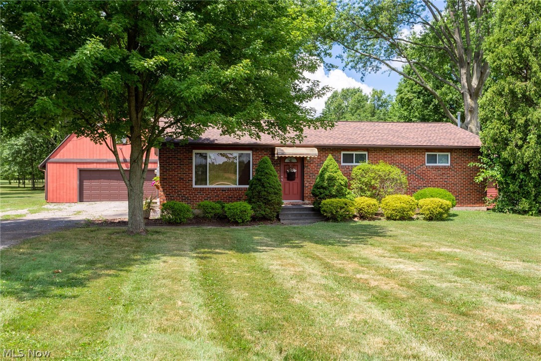 **Welcome to this Charming ALL BRICK RANCH** This home boast almost 6 acres has mature trees; pond and privacy, your own private nature retreat!!  Entertain family and friends in this one floor living with a open floor plan.  3 bedroom ranch provides a large living room area that provides natural light with a beautiful large window with wood blinds.  The living room is open to the dinette area with sliding glass door and kitchen for easy entertaining.  The kitchen has under cabinet task lighting; a newly installed microwave;  stove and refrigerator have been lightly used. The whole house has been freshly painted with neutral colors and recess lighting throughout.  The bathroom has been updated and provides double duty as well, with brand new washer and dryer installed along with a utility tub, tucked in a closet.  In addition, the bathroom provides a very large walk-in storage area with shelving. The 2 story garage/barn is 30x30 with a loft! Electric has been recently updated with elec