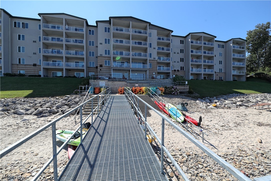 Welcome to the luxurious Lakefront condominiums of Lake Erie Vista at Geneva-on-the-lake! These condominiums consist of 47 luxury units within a 5 story, 2 elevator serviced building that overlooks a private beach along Lake Erie. This is an end unit with breathtaking views throughout the open floor plan. The upgraded kitchen provides granite counter tops, tons of cabinets for storage as well as a large island with bar-top seating. From the living room, walk out onto the private balcony with stunning Lake Erie views. The perfect spot for your morning coffee and watching the amazing sunrise. The master en-suite features a huge walk-in closet with built-ins and a stunning master bath with a step-in, tiled rain shower and his and her vanities. There is a second master suite that has a full bathroom as well as a walk-in closet. The third bedroom offers a large custom built in desk that would make for a great office or guest bedroom. Lake Erie Vista offers a community room, an indoor heated