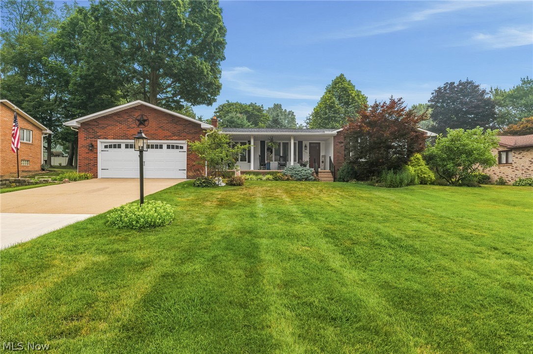 Welcome to this beautifully updated three-bedroom, two-and-a-half-bath, all brick ranch that offers an arrangement that is both spacious and welcoming. Nestled in a quiet neighborhood, this home is perfect for anyone who loves to entertain or simply enjoy comfortable, modern living. Step inside to an inviting foyer with vinyl plank flooring that carries throughout the main level. The heart of the home is the updated eat-in kitchen, featuring solid surface countertops, a tile backsplash, pantry, and newer stainless-steel appliances (2025). The open concept design flows seamlessly into the family room with vaulted ceiling, highlighted by a stunning floor to ceiling stone woodburning fireplace. Glass sliders lead to an incredible three season sunroom overlooking a private back yard an ideal space for summer cookouts, morning coffee, or relaxing evenings. All three bedrooms are generously sized with ample closet space. The primary suite includes its own private bath with a shower, single vanity, and vinyl flooring. The main bath was completely updated in 2025. The finished lower level is an entertainer's delight, complete with a bar area. Office with closet space and additional unfinished space provides a workshop with workbenches and ample storage. A dedicated, first floor laundry room was added in April 2026, offering true one-story living. Major updates include: New roof, gutters, and gutter guards (2025) Drainage for downspouts (2025) Epoxy coated garage floor and front porch (2026) New screen doors in the three-season room (2026) Driveway (2025) New Sink and garbage disposal (2026) New Carpet (2025) This is an exceptional opportunity if you are seeking a home that has been thoughtfully updated and lovingly maintained. Don't miss your chance to tour this wonderful property!