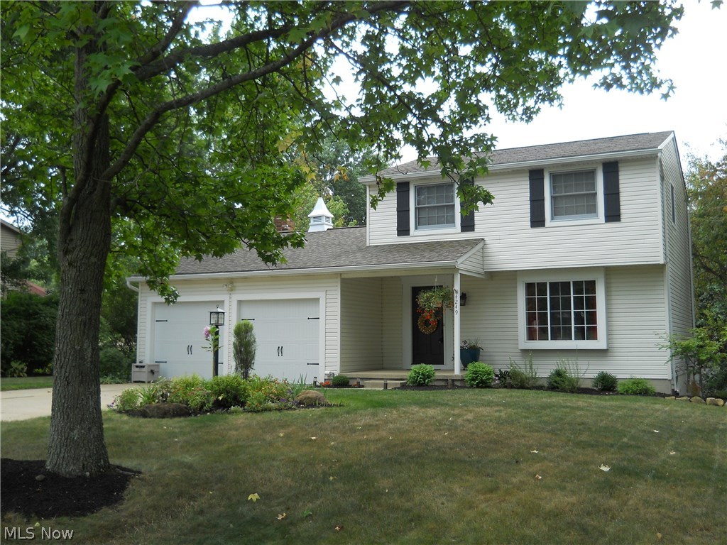 Stunning inside & out 3 bedroom/1.5 bath colonial w/approx. 1702SF including finished walk out lower level on private & beautifully landscaped lot centrally located in City of Green close to schools, library, shopping & expressway* Living room w/bay window & updated carpet* Spacious updated eat in kitchen w/ceramic floor & back splash, breakfast bar, mega cabinets having roll out shelves, trash drawer & pantry plus range, dishwasher, microwave & disposal* 1st floor family room w/brick wood burning fireplace (hearth & mantle) & Pella slider w/built in blinds to deck w/ pergola* 1st floor half bath* Master bedroom w/private access to oversized bath & 2 guest bedrooms complete the second floor (stairs & hallway w/updated carpet)* Walk out lower level w/finished recreation room & slider to patio* Plenty of storage & work space in unfinished part of basement, plus additional access door to covered patio...ideal for workshop* 2 car attached garage* Kinetico water softener* 2 laundry chutes (