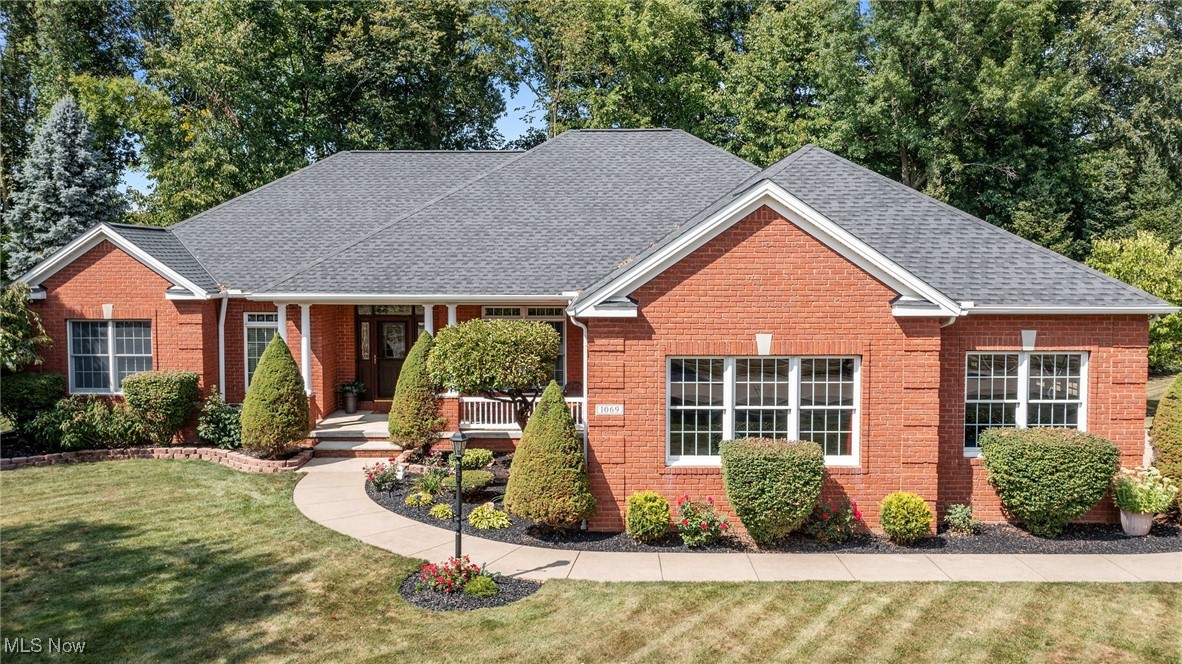 Under Contract-accepting backup offers. Featuring a custom built brick ranch recently remodeled and freshly painted interior 2024. This 4 bedroom, 3 full bath is meticulously kept inside and out. Located in the highly desirable Waterford Crossing sub-division and situated on a large .66 acre corner lot with wooded backyard. The backyard was renovated in 2022 with the removal of over 20 trees to open up and enjoy your evenings on a newly built 20' round fire pit patio or relax on the new 2024 Custom built deck which inlcudes an 8-person hot tub. This home speaks quality throughout with an open floor plan that boasts a great room w/11 ft artist designed ceiling and customized ceiling fan. The fireplace completes the room flanked by 8 ft. windows with transoms which boasts elegance. Let's don't forget the beautiful Brazilian cherry hardwood floor that is the center of attraction. Enter through the French doors with stained glass transom window leading to the office with 9 ft ceilings, crown molding and a bay window with a built-in bench. Open the sliding door to the 14 ft vaulted ceiling four season room with a gas potbelly fireplace to enjoy the beauty of outdoors all year long. The kitchen is a chef's dream with custom cherry cabinets and all newer stainless-steel appliances.  The refrigerator has the Family Smart Hub, Bosch dishwasher, 5-burner gas cook top, built-in conventional oven/microwave with Corian solid countertops and new backsplash. The Primary bedroom with tray ceiling, crown molding with custom fan leading to the primary bathroom. Walk-in closet and new stone vanity top with custom built cherry cabinet. Second full bathroom all new walk-in shower and new stone vanity top with custom cherry cabinet. Lower level has 8 ft drywall finished ceilings. Created in 2020 a Junior Suite awaits your guest that prefers privacy. Full walk in shower and living room suite. Just off from the suite is an updated full Man Cave. Large 3-car garage w/ builtin workbench.