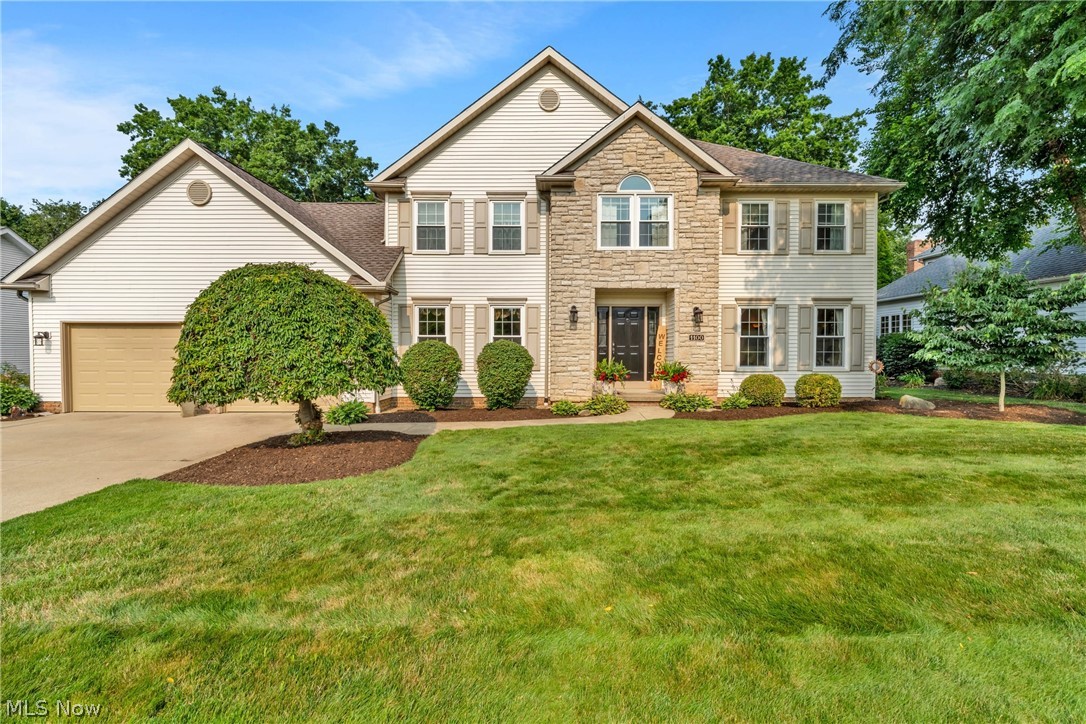 Welcome home to this spacious colonial offering major updates, exceptional outdoor living, and one of Wadsworth’s most desirable neighborhoods—with no HOA! From the moment you arrive, you’ll appreciate the beautifully landscaped front yard, stacked stone accents, welcoming entry, oversized driveway, brand-new roof and windows (2025), and new garage doors (2026). The backyard features a spacious deck, fenced yard with a rear gate, raised garden bed, and a peaceful setting perfect for relaxing, entertaining, and enjoying breathtaking Ohio sunsets. Step inside to a welcoming foyer featuring 3/4-inch walnut hardwood floors, crown molding, and two coat closets. The formal living room offers brand-new carpet and is perfect as a sitting room or home office. The inviting family room features newer carpet and paint, a gas fireplace, recessed lighting, and updated oak trim. The kitchen offers granite countertops, DuraCeramic flooring, and all kitchen appliances stay. An energy-efficient slider (2025) opens to the deck, extending your entertaining space. The dining room showcases Venetian plaster walls and a tray ceiling, while the first-floor laundry includes a utility sink and ample cabinetry. A wider-than-average half bath adds extra comfort. Upstairs, the spacious owner’s suite features a private bath with new LVP flooring, dual sinks, a garden tub, and separate shower. Three additional bedrooms and a full bath complete the second level. The partially finished basement provides approximately 900 square feet of additional living space, abundant storage, a workshop, and is plumbed for a future full bath. The oversized 600-square-foot garage offers exceptional depth, hot and cold water, and plenty of room for vehicles, hobbies, or storage. Come experience Wadsworth’s big heart, small-town charm, and a place you’ll be proud to call home.