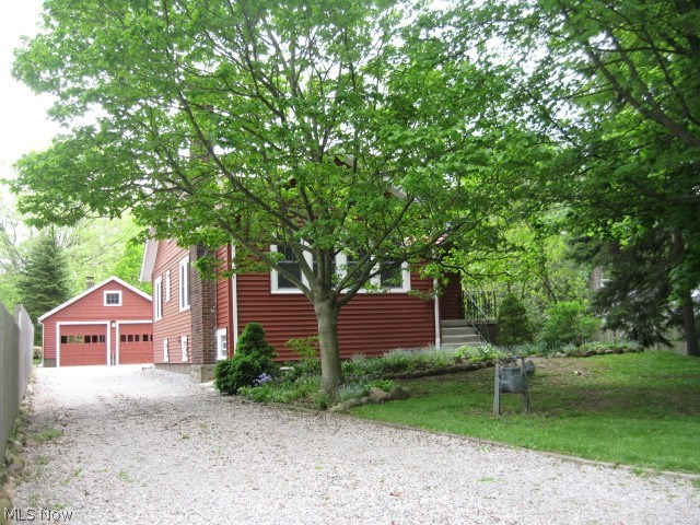 Welcome Home!! Nothing to do but move in this quaint vintage home with Craftsman touches. Featured are hardwood floors throughout, 2 full baths, 4
bedrms, living rm fireplace ready for gas logs. Large dining rm with gorgeous built-in china cabinets & glass doors on each side of window seat. Home feels fresh & clean with new paint throughout. Kitchen newer Bosch dishwasher & microwave. Screened in porch, for added enjoyment features views of wooded lot with over 20 mature trees, large perennial garden with 50 plus perennial collection. Hosta & Hydrangeas. Visit the new concrete patio the sounds of tranquil fountain & views of garden. New sidewalks were added with patio. Lower level includes new water system 2 yrs, new copper pipes added. Electric updated with new box 2017. Newer windows throughout the home including back porch 2016 plus glass block in lower level. Roof with dimensional shingles on house & garage 2007, down spouts, gutters & leaf guards. New insulated vinyl siding from