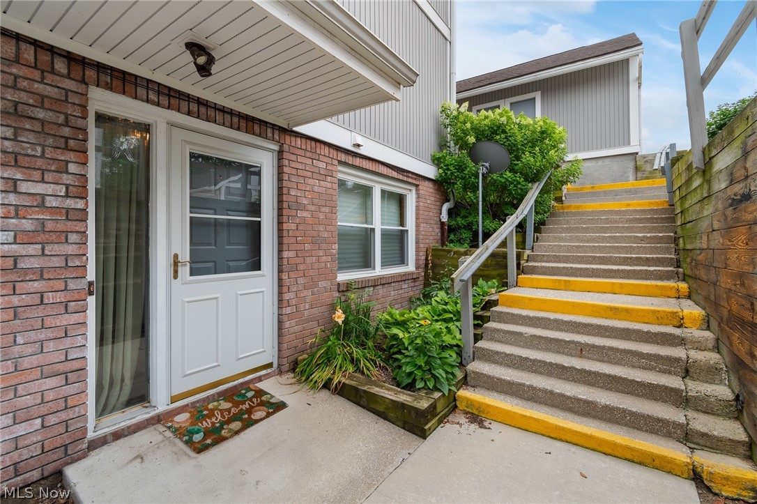 Nestled between Portage Lakes and Long Lake, this spacious single-floor condo offers comfortable living in a peaceful setting. The foyer leads to a convenient guest bedroom at the front of the home, while the hallway opens into the fully applianced kitchen overlooking the dining area and inviting living room with a cozy fireplace. The private primary suite is tucked away at the rear of the home, creating a relaxing retreat. Step outside to the screened-in porch, where you can enjoy tranquil views of the canal and mature trees that provide exceptional privacy. Conveniently located near fishing, restaurants, and highway access, this condo combines a serene lifestyle with everyday convenience. Schedule your private showing today!