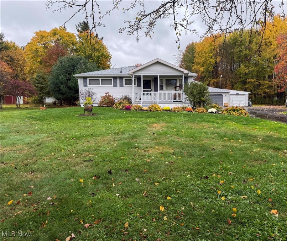 Just move right in! This ranch sits off the road on 2.51 acres in a rural setting with all entities just a few minutes away.. All window coverings are 2" faux wooden blinds. The entrance has a very practical large guest closet / pantry. Two steps down and you are in the sunken family room with a wood burning fireplace and french doors leading out to the hot tub on a nice size deck. Kitchen is updated with a newer gas stove, newer dishwasher, and side by side refrigerator / freezer. Formal dining room with plenty of light takes you into the hallway with 3 bedrooms.  The master bedroom has an entire wall of closet! The bathroom has a beautiful ceramic tile floor. Both the front and side porches have a wooden railing. There is a 2 car garage with electricity and water.  There is a three-car turn around an attached enclosed carport and shed. All roofs are new.
