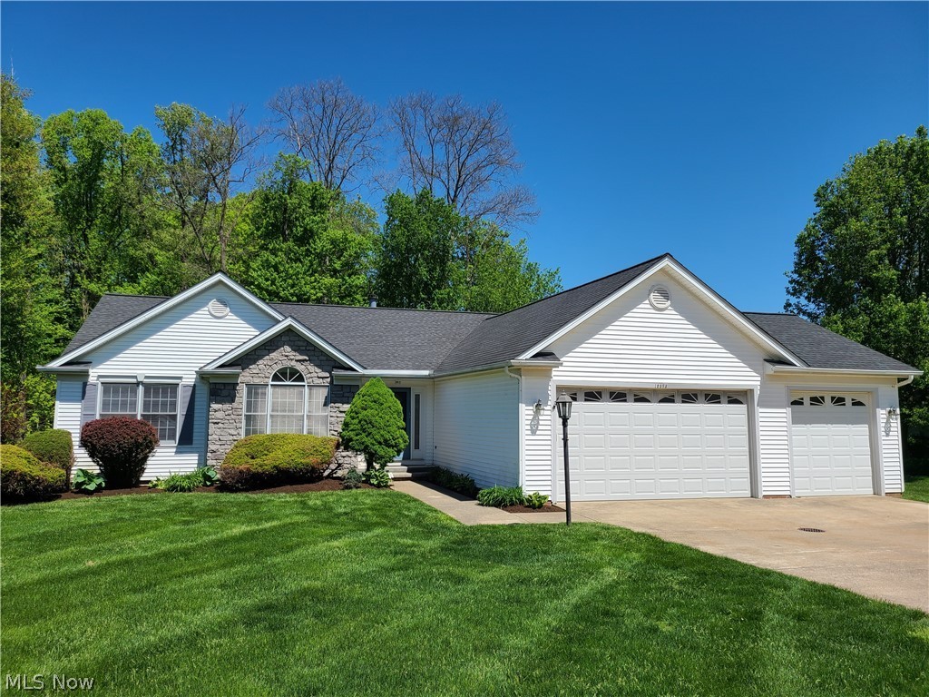 Welcome to 10314 Andover Drive. This well kept 3 bedroom, 2 full bath Ranch home in Twinsburg School District has amazing features! Brand new carpet and paint throughout. Vaulted owner's suite includes full bath with double vanity, Jacuzzi tub, new flooring. Includes dining room, open concept Kitchen and vaulted family room with beautiful gas fireplace. First floor laundry. Upgraded interior insulation added to bedrooms, bath and laundry for sound dampening. Walk out onto a stamped concrete patio that backs up to the amazing Tinkers Woods Park system, providing privacy, views, and convenience to adventure the trails. Whole house alarm system. Oversized 3 car insulated garage with 8 foot high doors, with an efficient natural gas heater and floor drain it is perfect for keeping ice free cars and a workshop. Drain for wash basin as well. Huge basement with high ceilings, newer water heater, high efficiency furnace and regularly serviced. Basement plumbed for full bathroom. Complete tear-o
