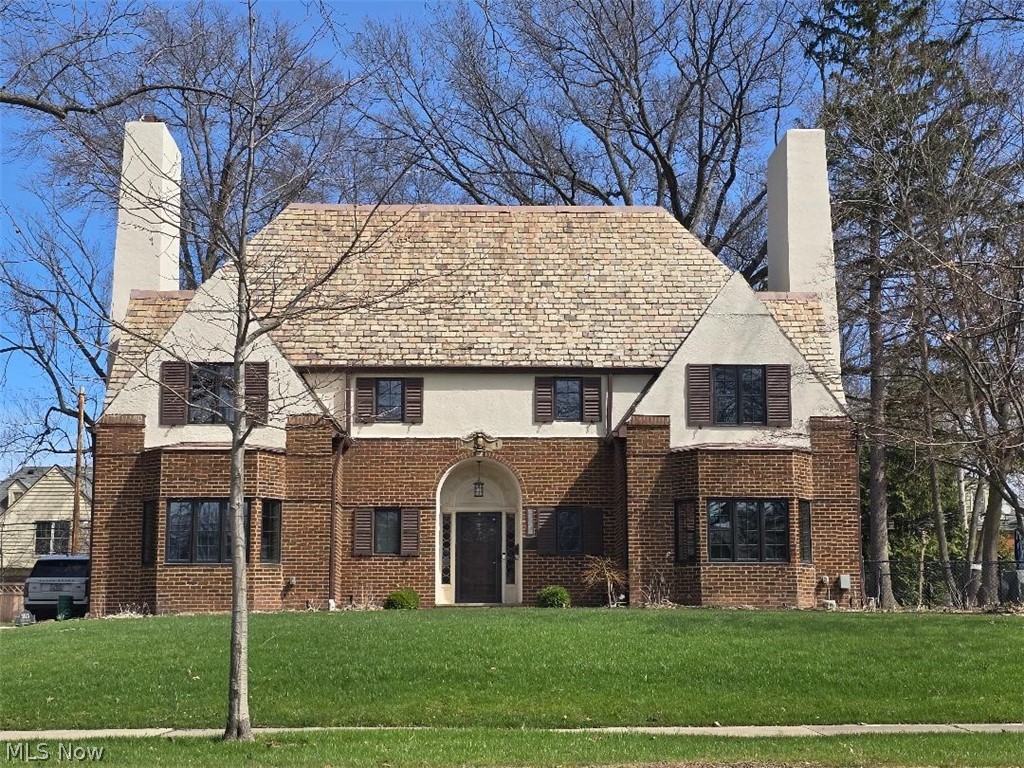 Nestled in the heart of Shaker Heights, this iconic English Cottage Colonial is a true landmark—an original Van Sweringen Demonstration Home, meticulously crafted w/timeless charm & modern amenities. A rare blend of old-worldelegance & contemporary comfort, this home is an extraordinary testament to craftsmanship & design. Key
Features:Historic Charm: As a Shaker Heights Landmark Home & one of the original Van Sweringen models, this home is a piece of architectural history. The stunning woodwork throughout, from crown moldings to rustic paneling, it speaks to the home’s enduring craftsmanship. Spacious & Elegant: With approx. 3,000 sq. ft. of living space, the layout is both functional & impressive. The main floor features a grand octagonal foyer, leading to a formal living room w/fireplace & formal dining room—perfect for entertaining. A bright, sunlit cook’s kitchen w/granite counters, stainless steel appliances, & ample cabinetry is a chef’s dream. Private Office/Library: Beautifully appointed private office w/custom-built cabinetry. Cozy. Rustic. Ideal for work or reading & relaxation. Master Suite: The Large master offers a private retreat w/updated bath, spacious walk-in closet w/custom-built organizers. Flexible Living Space: 2nd floor w/3 generous bedrooms & hall bath plus a finished 3d w/private guest suite w/private bath—ideal for visitors or a private hideaway. Modern Updates & Systems: Updated to suit today’s lifestyle, featuring 2 furnaces, central air, & fully waterproofed basement. 2nd-floor laundry conveniently adjacent to the master. So many recent upgrades & updates! Incredible Yard/Gardens: Set on a double lot, surrounded by lush, beautifully landscaped grounds. Large shade trees & two patios. An idyllic outdoor retreat, perfect for enjoying the seasons. If you’re hosting a grand gathering or enjoying peaceful solitude, it is the rare combination of historic prestige & modern comfort. An opportunity to own a piece of Shaker Heights history.