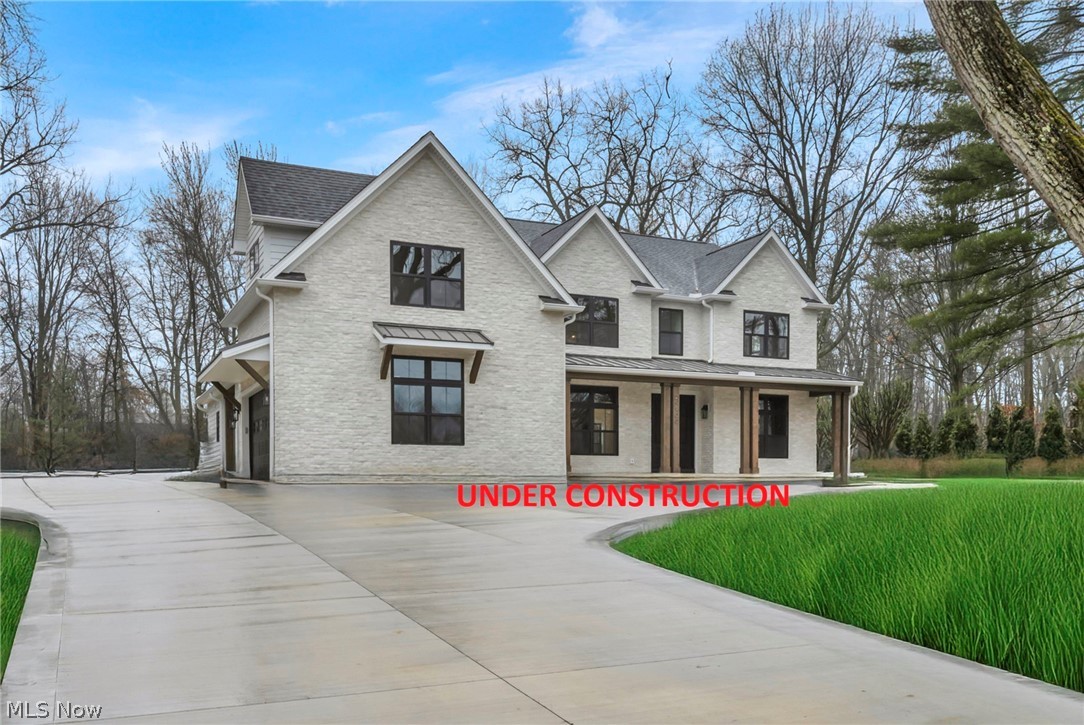 A distinguished showcase of architecture and craftsmanship, this newly constructed residence is perfectly positioned along the golf course within one of the area’s most sought-after communities. Offering over 5,800 square feet of living space, including 4,300 above grade and an additional 1,500 below, this 5-bedroom, 6.5-bath home reflects timeless design, curated materials, and exceptional attention to detail. Walls of windows invite natural light throughout, accentuating a dramatic two-story great room with soaring ceilings. The chef’s kitchen serves as a refined focal point, appointed with designer-selected, furniture-quality cabinetry, professional-grade appliances, and an expansive island—seamlessly connecting to open living and dining spaces designed for both everyday living and sophisticated entertaining. A private first-floor en-suite provides ideal flexibility for guests or multigenerational living. The upper-level primary suite offers a true retreat, complete with a spa-inspired bath, expansive walk-in closet, and a private walk-out balcony overlooking the golf course. The finished lower level extends the home’s living experience, offering 1,500 square feet of thoughtfully designed space for recreation, entertaining, and relaxation. Set against the backdrop of the course, the property offers a rare combination of views, privacy, and lifestyle. An exceptional opportunity to personalize select finishes and tailor the home to a refined vision. Estimated completion: September 2026. Images represent a previously completed residence with similar design intent and finishes.