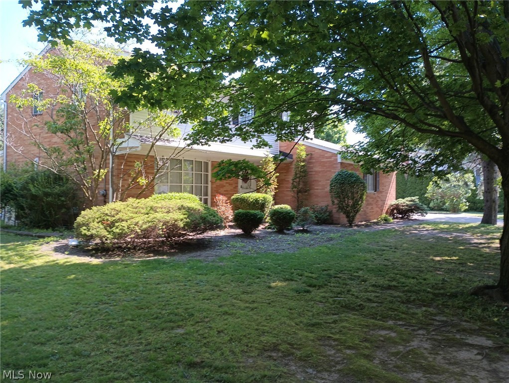 Location is everything and this two-story colonial home at 24500 Westwood Road, in Westlake is ideally located. It's also a welcoming
place. Enter through the front door to a slate covered front hallway. This leads you to the larger formal living room with its huge bay window. The living room opens up to the dining room with its sliding door to the backyard patio. A beautiful modern eat-in kitchen with ample cupboard and counter space, built-in stove top and gas oven with electric broiler awaits your use. Next, a cozy living room with a wood-burning fireplace for comfortable evenings on cool days. There is a large three-season room with new windows that opens to an outdoor covered patio, a wooden deck, and a beautiful, large, fenced-in backyard any family would enjoy. There is a large storage barn in the backyard to hold lawn and play equipment and even fit a car or truck. A full laundry room is at your disposal with a utility sink as well. There is an attached, two-car garage with a work bench. There is also an underground garage attached
to the basement. There are five roomy bedrooms upstairs with carpeting. An ample attic with much storage is off one bedroom. Under the carpeting in all bedrooms is the original maple hardwood, finished floors, which continue down the hall and stairway. The formal living room and dining room also have maple hardwood floors. This house has three lovely, full bathrooms as well. In the basement you will find a finished family room with bookshelves and a full wet bar. There is also a study with six cameras outside the security system. Additionally, the basement has a furnace room with a utility sink and clotheslines up for your use for hang drying clothes. Behind that is the underground garage with a huge storage area. No need to rent storage if you own this house!