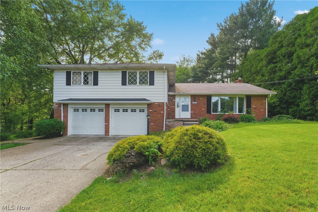 This split-level home features a smart, functional layout offering an impressive amount of space, updates, and flexibility on nearly half an acre with a fully fenced backyard and large 2-car attached garage. The main level showcases a large open concept living, dining, and kitchen area, ideal for everyday living and entertaining. The kitchen has been recently refreshed with new backsplash, giving it a clean, modern feel. Upstairs you'll find three oversized bedrooms, including a spacious primary suite with a fully updated en-suite bathroom. In total, the home offers three full bathrooms, providing convenience for households of any size. The lower level adds even more versatility with a dedicated office/bonus room, while the finished basement expands your options even further - perfect for a recreation room, second living area, guest space, or even a potential 4th bedroom. It also includes a kitchenette area, making it ideal for multi-use living or entertaining. Additional highlights include newer flooring, abundant natural light, a functional open layout, and a brand new roof adding major peace of mind for the next owner.