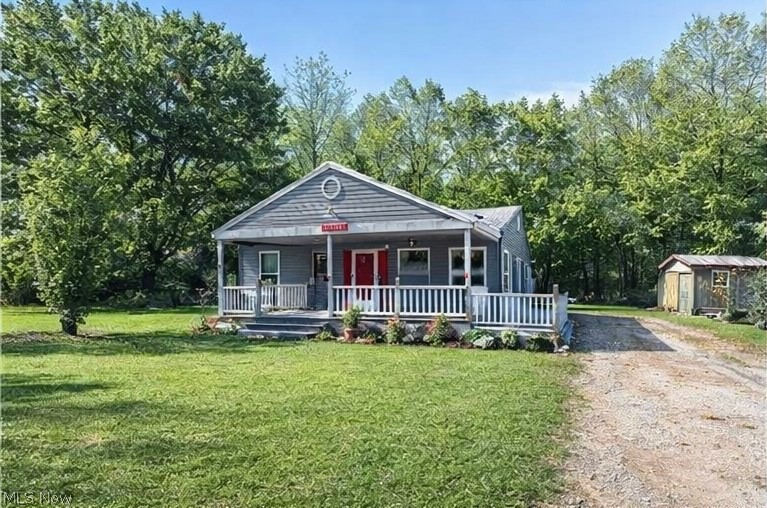 Escape to your own peaceful Muskingum River retreat! This well-maintained 2-bedroom, 2-bath home sits on two spacious lots backing to Friends of the Lower Muskingum River conservation land, offering beautiful wooded surroundings and river views.

Just steps away, enjoy county-owned riverfront access open for fishing and recreation — all the benefits of river access without the added cost and maintenance of waterfront ownership.

Inside, you’ll find a light-filled living room with vaulted ceilings and skylights, creating an open and airy feel. The efficient layout offers comfortable living space, abundant storage, and an open kitchen and living area perfect for everyday use or weekend getaways.

Outdoor features include a 12x24 covered porch ideal for relaxing, plus two storage buildings (10x12 and an additional shed) providing plenty of room for tools, kayaks, or recreational equipment.

A new roof adds peace of mind, making this property move-in ready for full-time living or seasonal enjoyment.

If you’ve been looking for an affordable river-area property with privacy, scenic views, and low-maintenance living, this is a rare opportunity worth seeing quickly.
