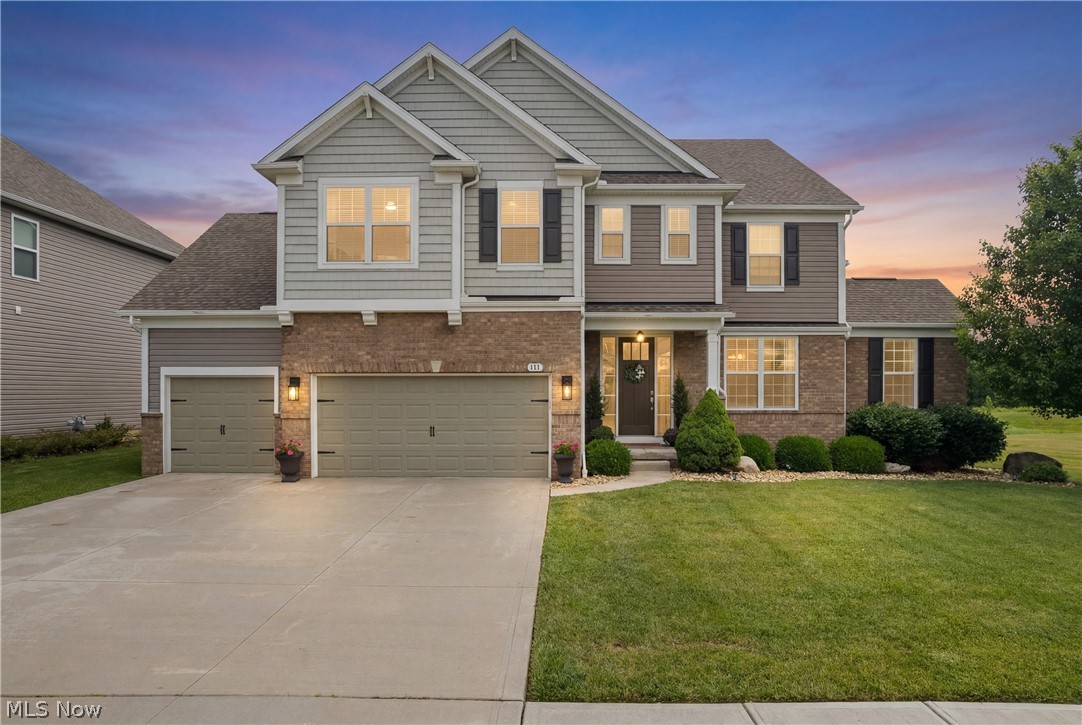 Welcome to this spectacular 2017 built colonial in The Preserve at Miller’s Farm, in the highly sought after Revere School District. This meticulously maintained home offers 5,996 total sq ft of space, including more than 4,300 sq ft above grade, with 4 bedrooms, 3.5 baths and a premium lot backing directly to a protected nature preserve. Thoughtfully designed for comfort and sophisticated entertaining, the open floor plan showcases exceptional craftsmanship and architectural detail, coffered and tray ceilings, soaring living spaces, recessed lighting and abundant natural light. The chef inspired kitchen is the center of the home, with quartz counters, large center island, premium appliances, walk-in pantry and dining area. Off the kitchen, the vaulted sunroom with gas fireplace offers stunning views of the preserve and provides the perfect setting to relax in every season. The main level also features a formal dining room, private office, versatile den, planning center, half bath and large laundry room with lockers and walk-in closet. Upstairs, the luxurious owner's suite serves as a private retreat with a sitting area, spa-like bath with soaking tub, double vanity, separate shower and expansive walk-in closet. 3 additional bedrooms, each with walk-in closets, 2 full baths and a spacious loft provide ample area for family and guests. The full basement is plumbed for a future bathroom and features an egress window; offers endless possibilities for a rec area, home gym or abundant storage. Outside, enjoy both side and rear patios overlooking beautiful grounds and protected green space, creating a tranquil, private setting rarely found in neighborhood communities. A 3 car attached garage completes this exceptional property. Ideally located near shopping, dining, parks and major highways, this move-in-ready home blends luxury, comfort and natural beauty. Don't miss the opportunity to own one of the most desirable homes in The Preserve at Miller's Farm.