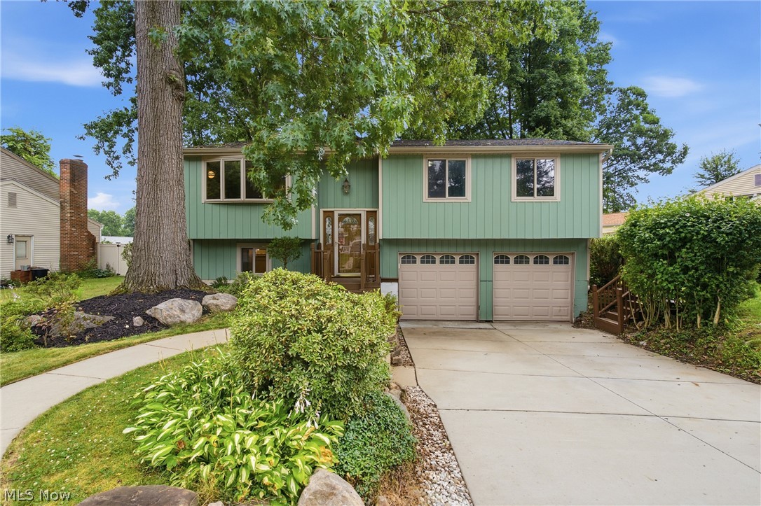 Welcome home to this beautifully maintained 4 -bedroom, 2-full-bath bi-level nestled on Oakhurst Dr in desirable Munroe Falls! This spacious home offers flexible living across multiple levels, perfect for families or anyone needing extra room to spread out. The upper level has all new carpet throughout, with a bright living room featuring a charming bow window overlooking the front of the home. The eat-in kitchen flows seamlessly into a dining space, with sliding glass doors leading out to the deck, ideal for entertaining or relaxing while overlooking the backyard. Down the hall are 3 comfortable bedrooms and a full bathroom. Head downstairs to discover a versatile 4th bedroom/bonus room, complete with a fully remodeled bathroom — perfect for a guest suite, home office, or in-law space. The lower level also features a convenient laundry area situated right next to the attached 2-car garage, making everyday chores a breeze. This home has been thoughtfully updated over the years, offering peace of mind for its next owner, including a new driveway and walkway in 2022, an upstairs bathroom remodel in 2024, a new roof in 2018, and a new furnace and A/C in 2022, and a New HWT in 2024 and electrical panel in 2026. With major systems already updated, this home is truly move-in ready. Don't miss your chance to own this well-appointed bi-level in a fantastic Munroe Falls location — schedule your showing today!