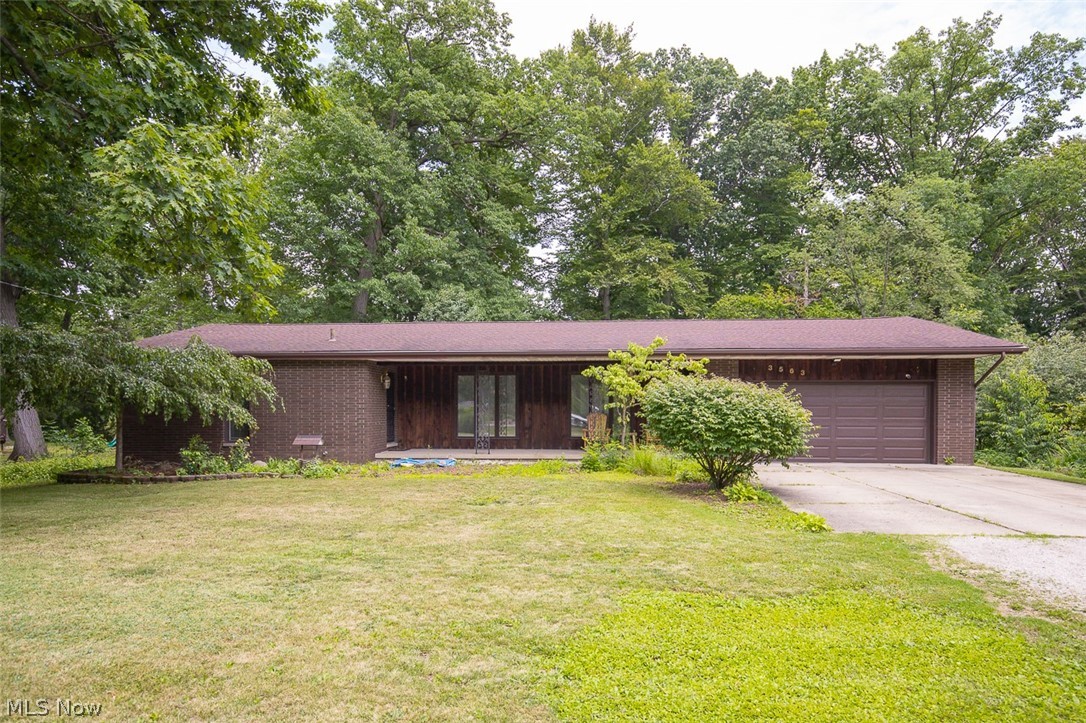 Welcome to 3563 Frawood Drive, a beautifully updated brick ranch situated on more than half an acre in desirable Uniontown located in the Green Local School District. This move-in-ready home offers four bedrooms, two and a half bathrooms, a heated two-car attached garage, and the ease of convenient one-floor living. The updated kitchen features stainless steel appliances and opens seamlessly to the dining area and family room, creating an inviting space for both everyday living and entertaining. The main level includes a cozy family room with a fireplace, a spacious primary suite with a private ensuite bath, two additional bedrooms, a full and half bath, and first-floor laundry. The partially finished basement adds valuable living space with endless possibilities for a recreation room, media room, home office, gym, or guest accommodations. An additional room with a walk-in closet and egress window offers even greater flexibility, while the unfinished portion provides ample storage space. For added peace of mind, the seller is including a one-year home warranty. Don't miss your opportunity to make this exceptional property your next home—schedule your private showing today!